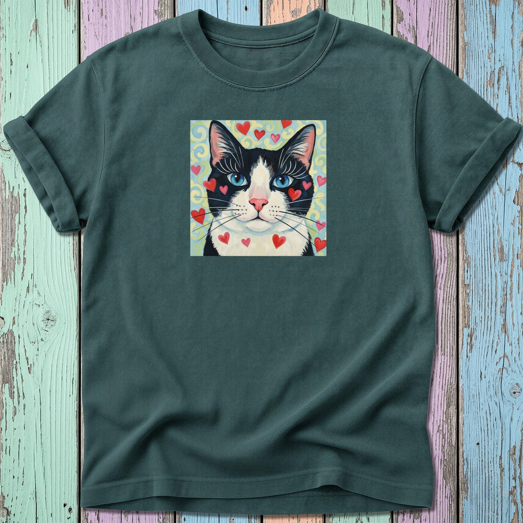 Dark green t-shirt with a black and white cat's face surrounded by red hearts.