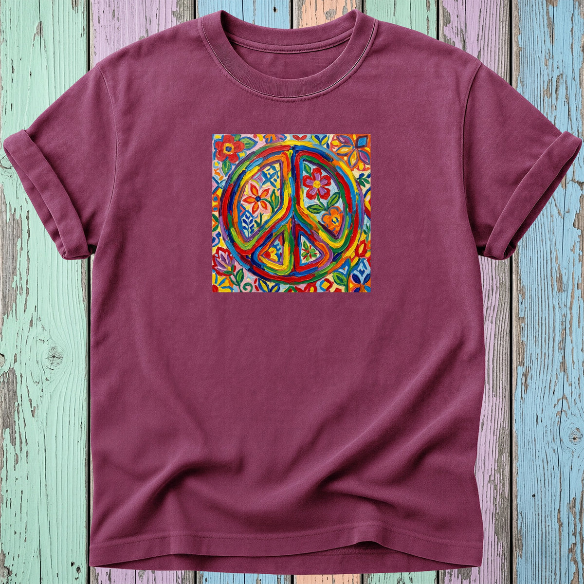 Burgundy t-shirt with colorful, floral peace sign graphic on the front.