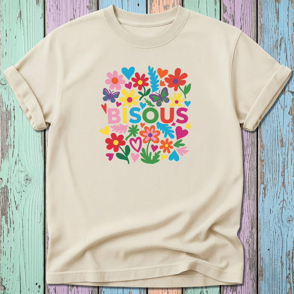 Cream t-shirt with colorful floral "BISOU" graphic.