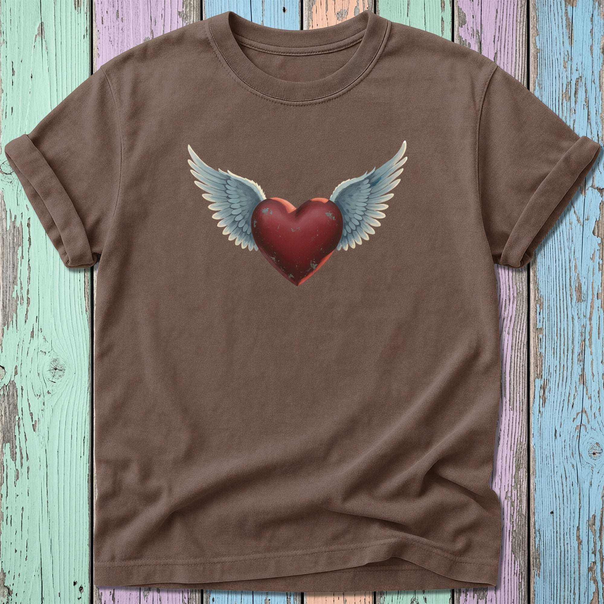 Brown t-shirt with a winged red heart graphic.