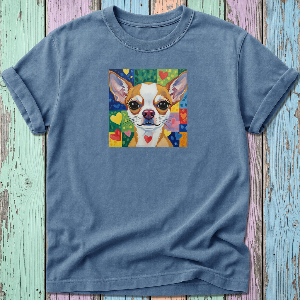 Chihuahua portrait with colorful heart pattern on blue t-shirt.