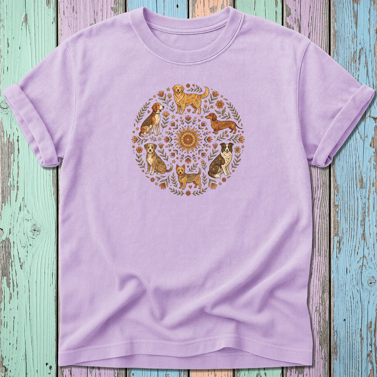 Lilac t-shirt with a circular mandala design of various dogs and floral elements.