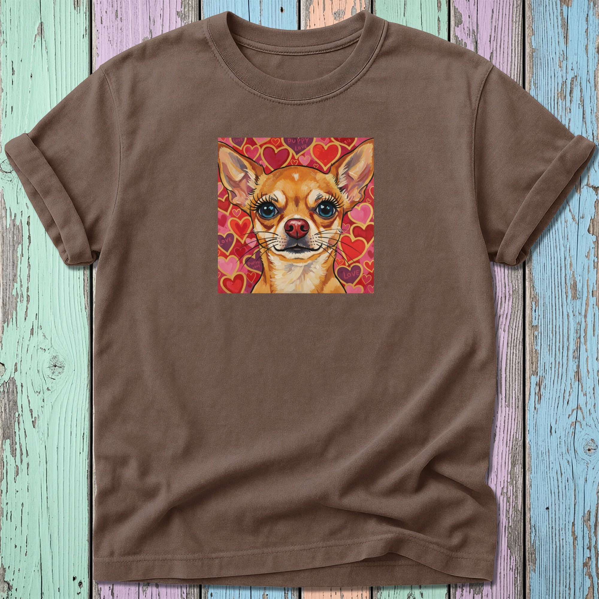 Brown t-shirt with a stylized chihuahua illustration surrounded by hearts.
