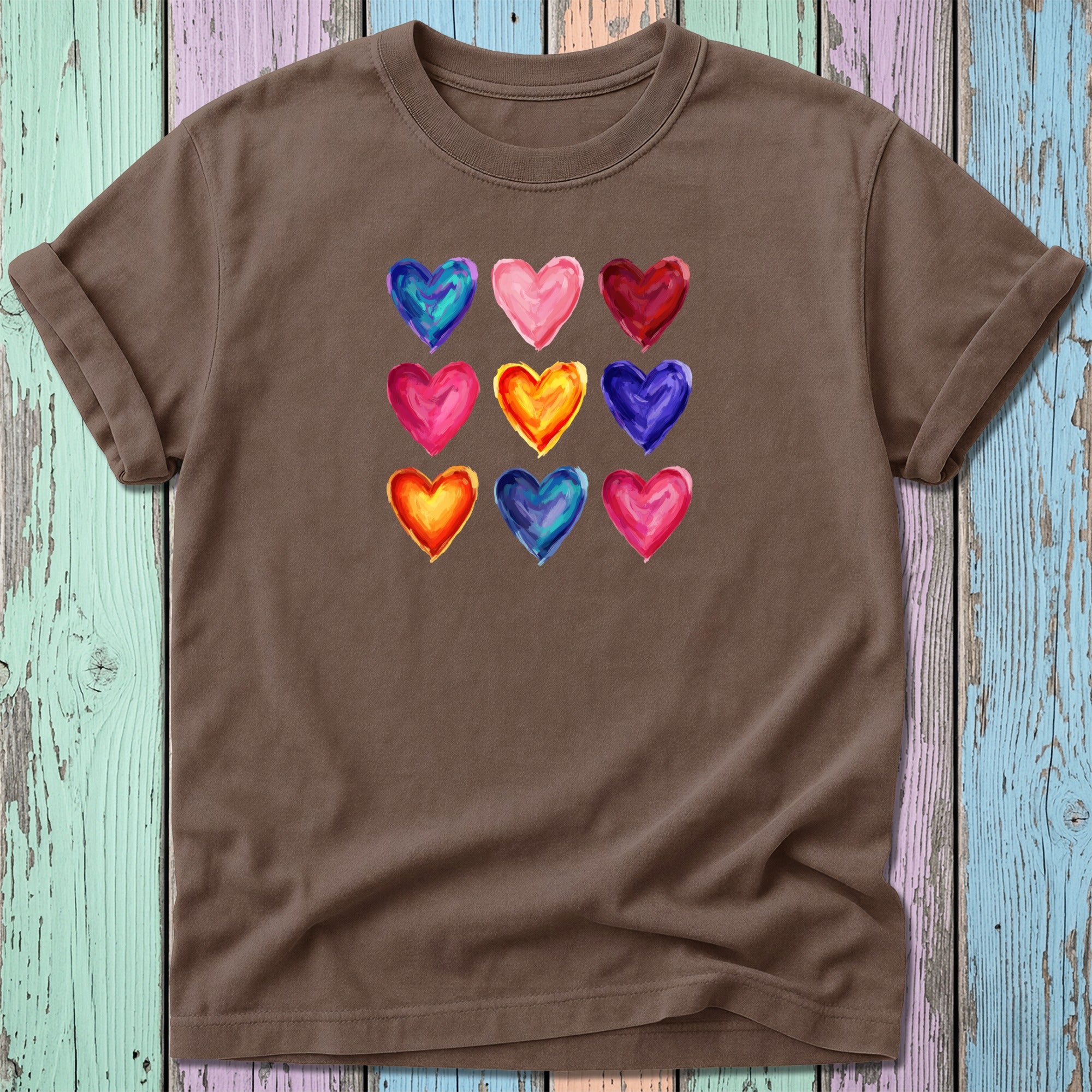 T-shirt with grid of nine colorful watercolor hearts.