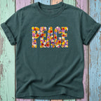 Dark green t-shirt with the word PEACE formed from colorful flowers.