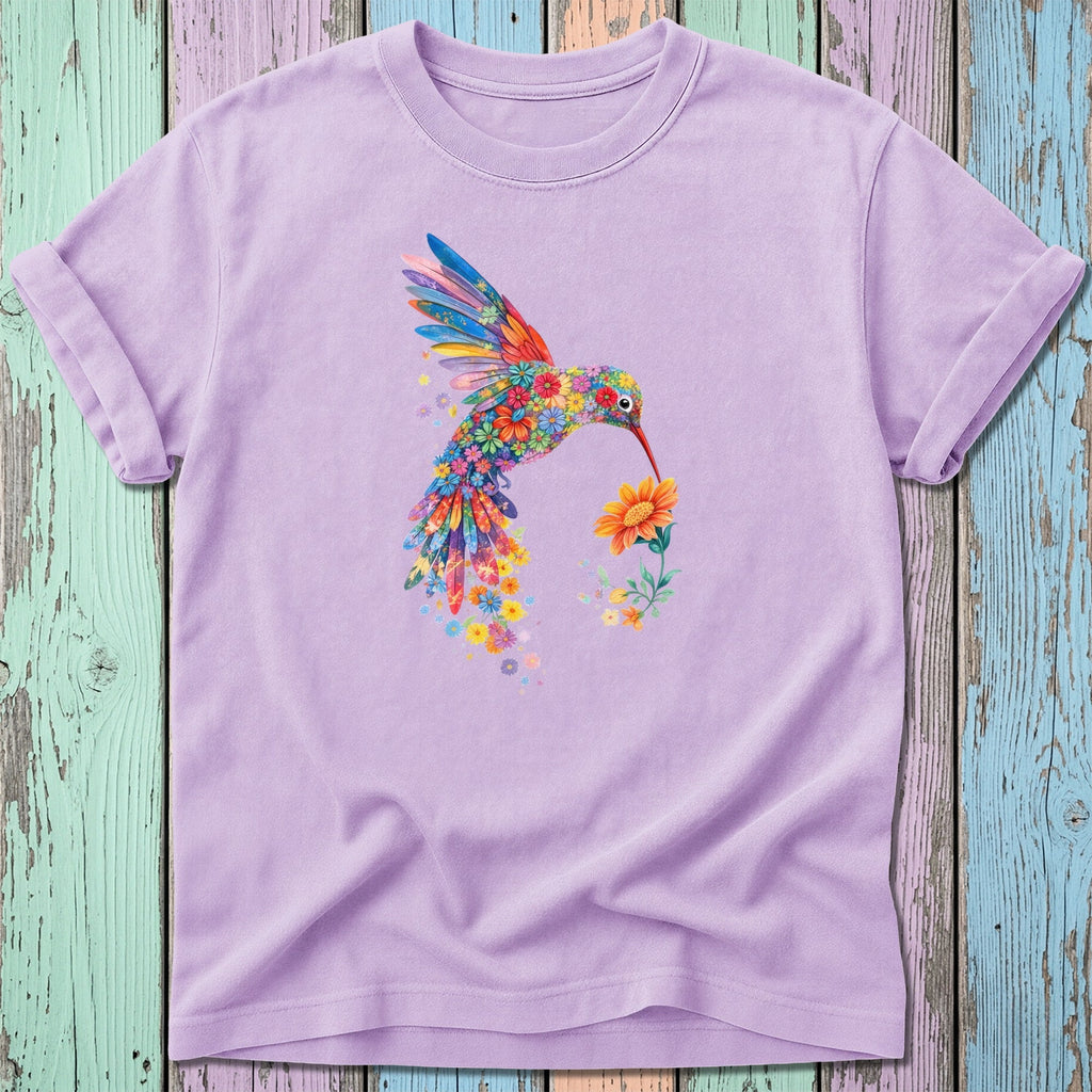 Lavender t-shirt with colorful floral hummingbird holding a yellow flower.