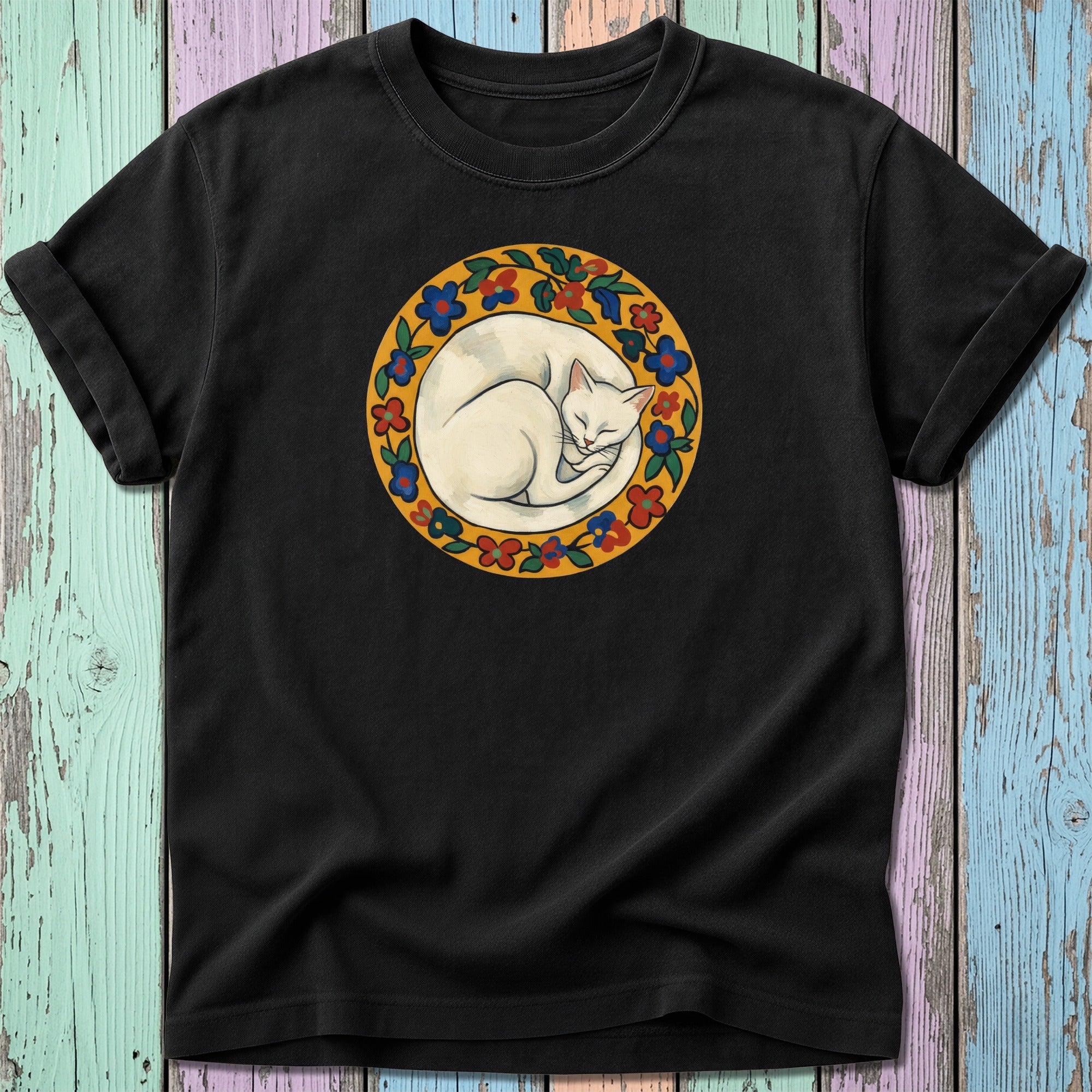 Black t-shirt featuring a circular illustration of a white cat curled up.