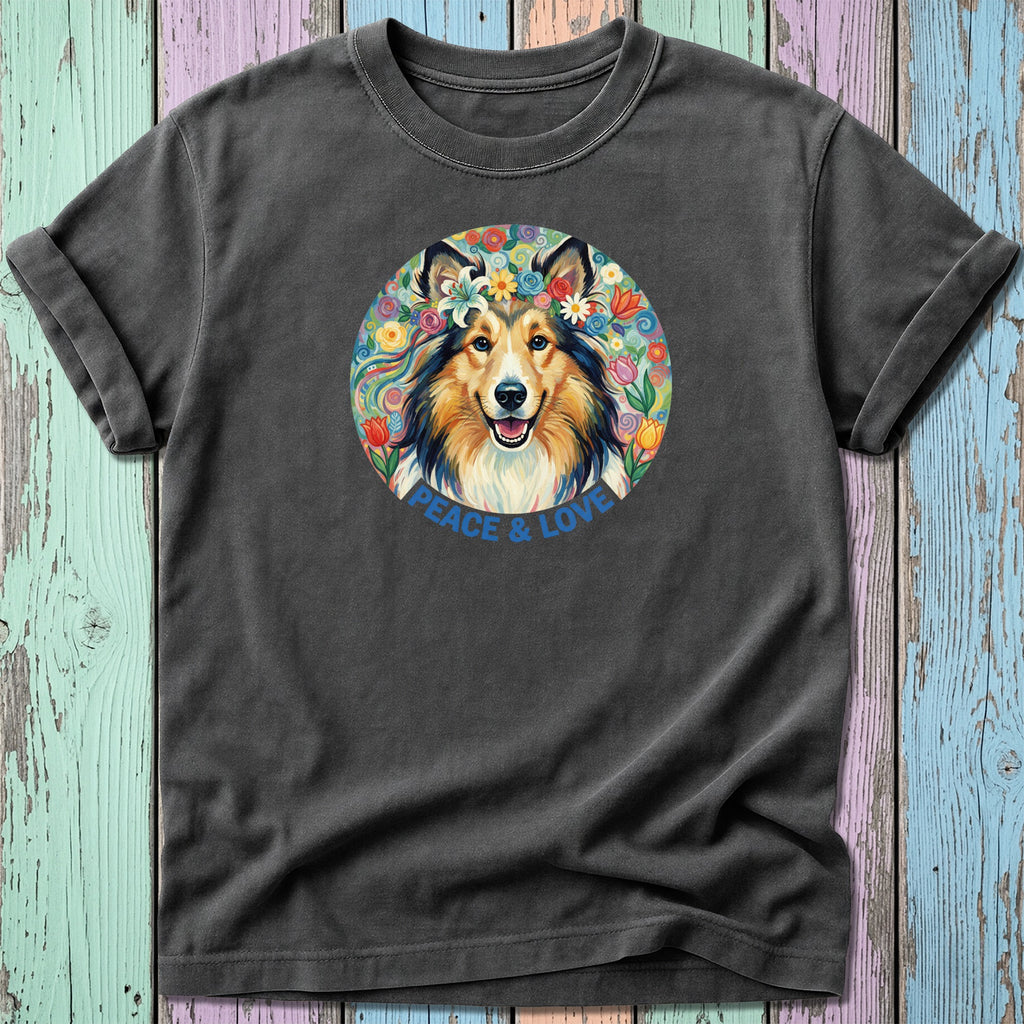 T-shirt with a watercolor painting of a smiling collie dog wearing a flower crown, surrounded by floral art and text that says "Peace & Love".