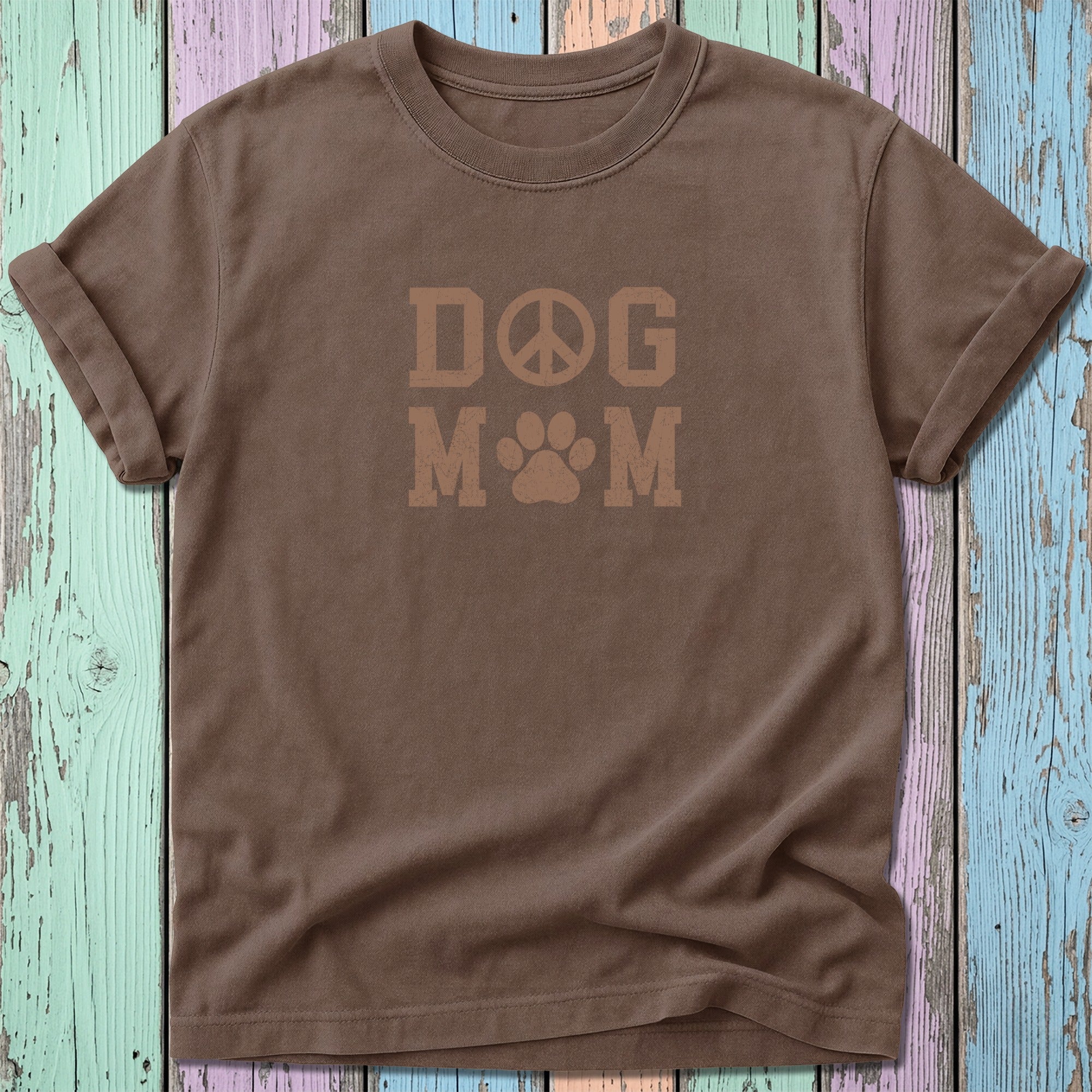 Brown t-shirt with "DOG MOM" text and a peace symbol and paw print.