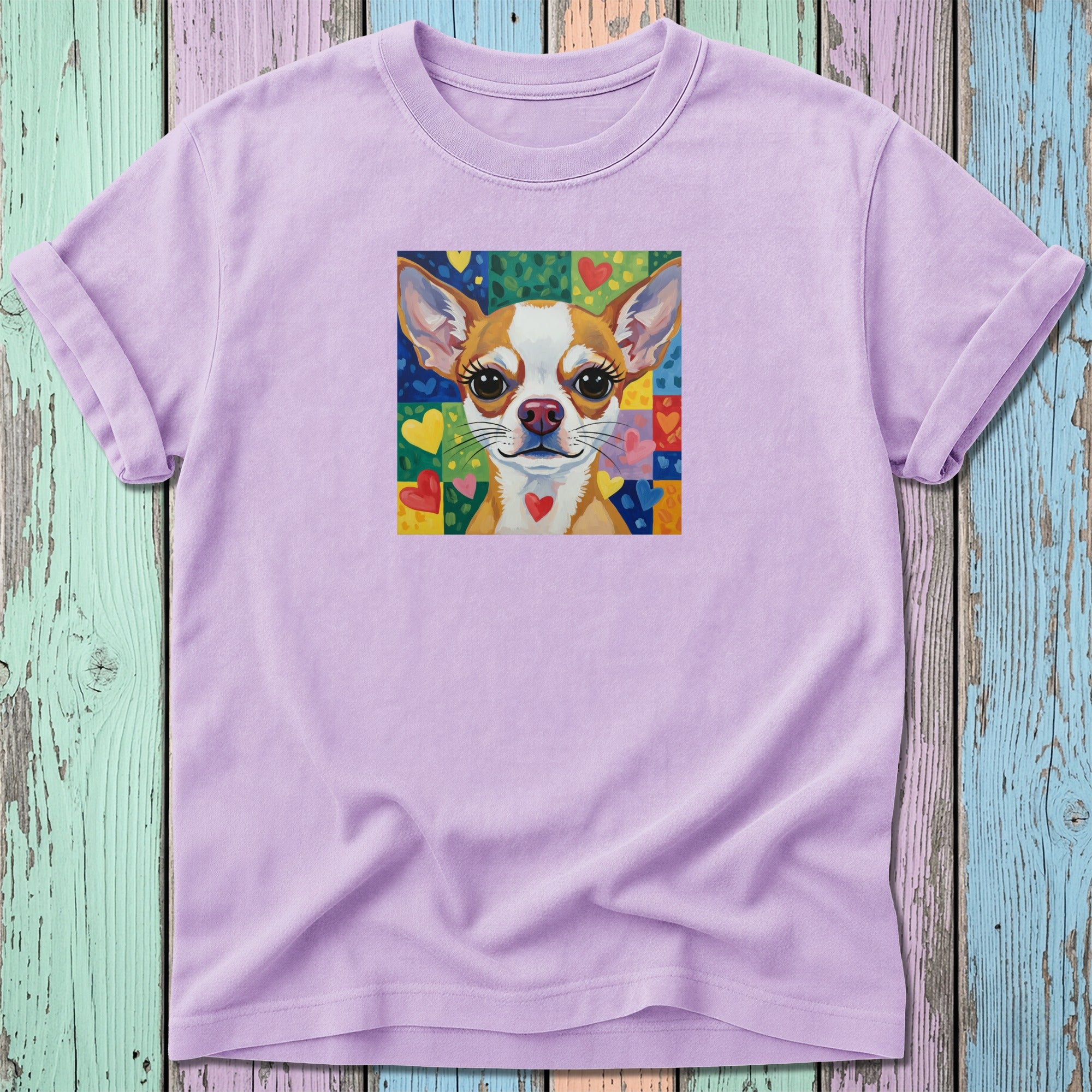 Lavender t-shirt with cartoon chihuahua and colorful heart pattern.