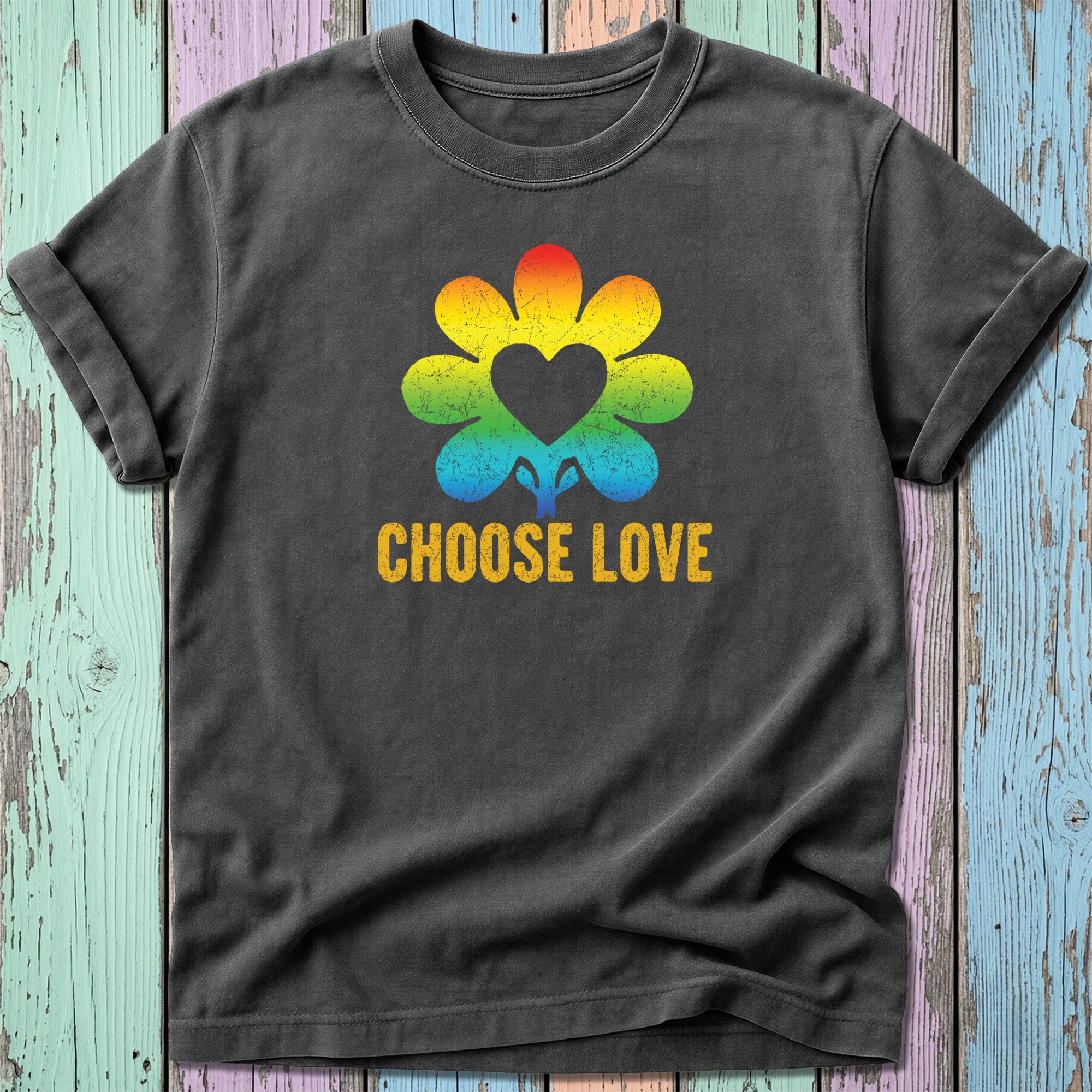 Dark t-shirt with a rainbow flower featuring a heart and the text "CHOOSE LOVE."
