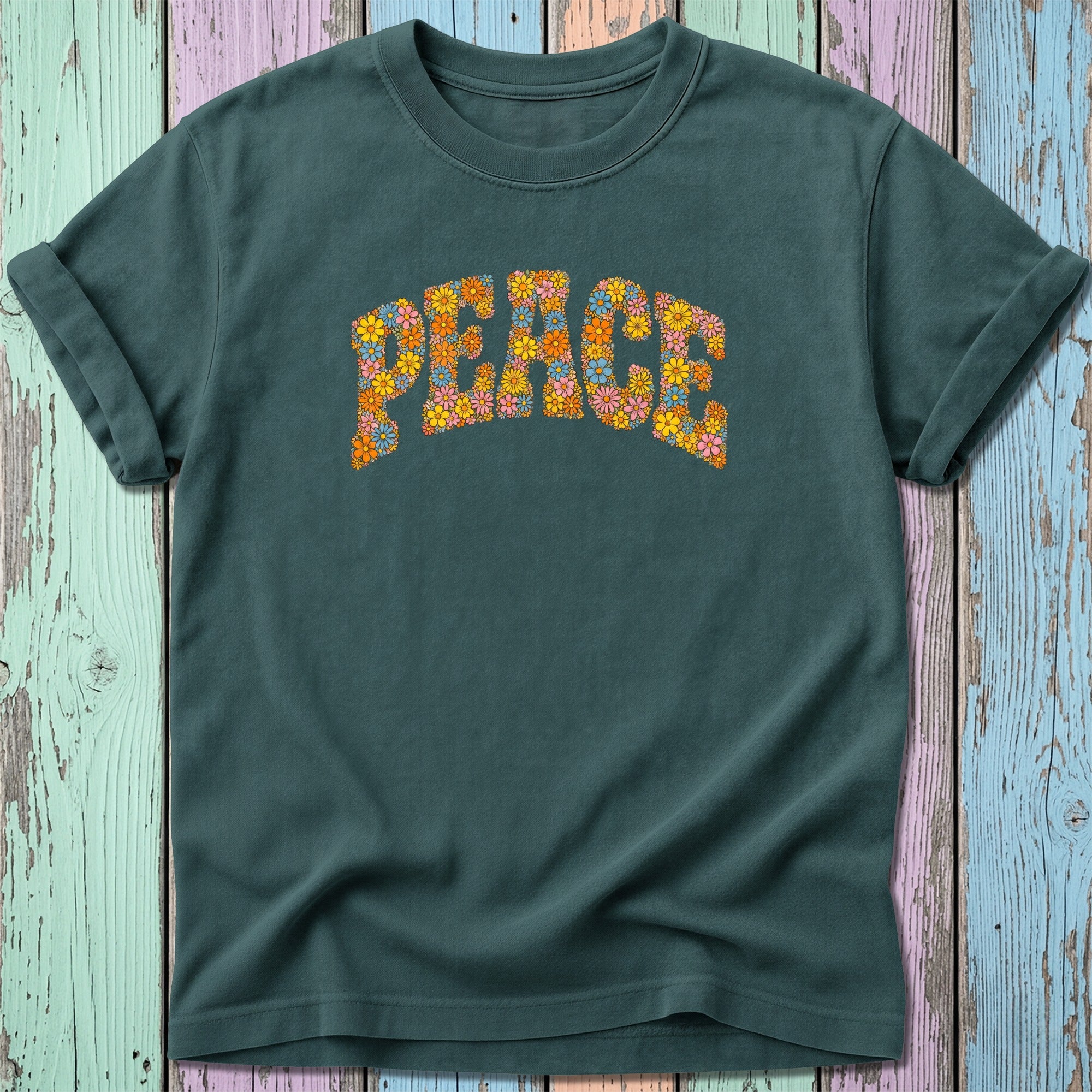 Dark green t-shirt with "Peace" in colorful floral letters.