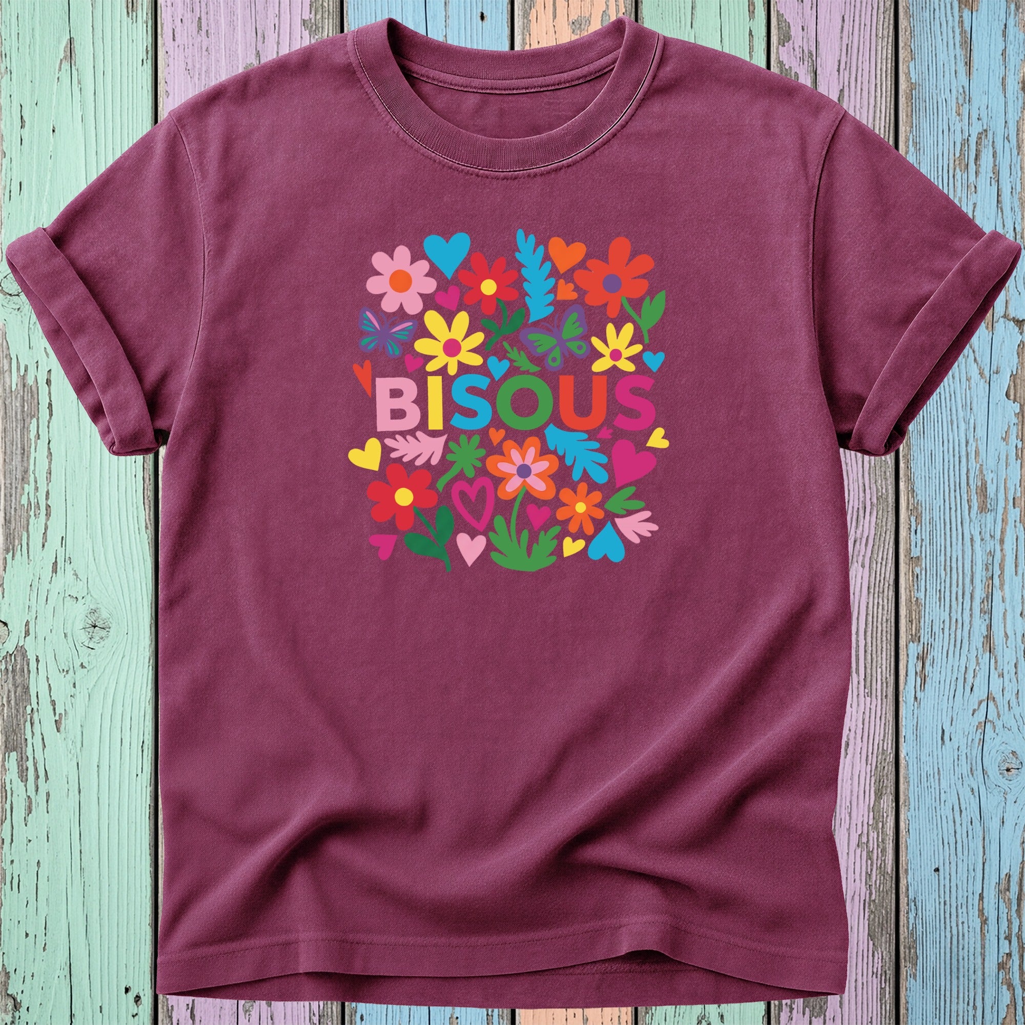 Maroon t-shirt with colorful floral design and "BISOUS" text.