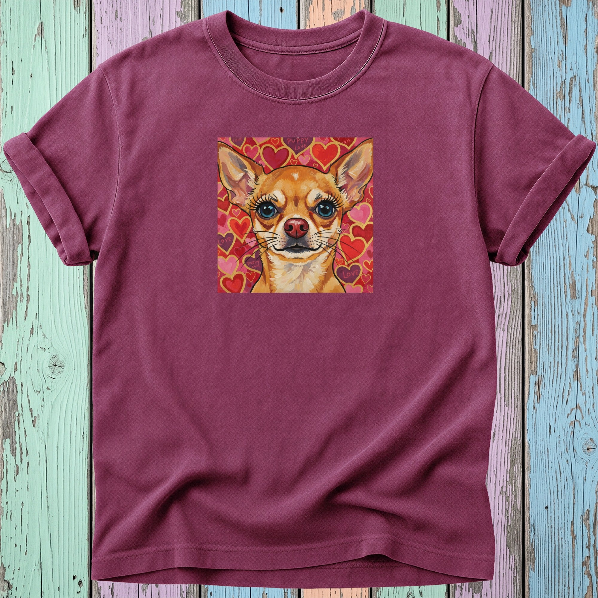Maroon t-shirt with a chihuahua portrait surrounded by hearts.