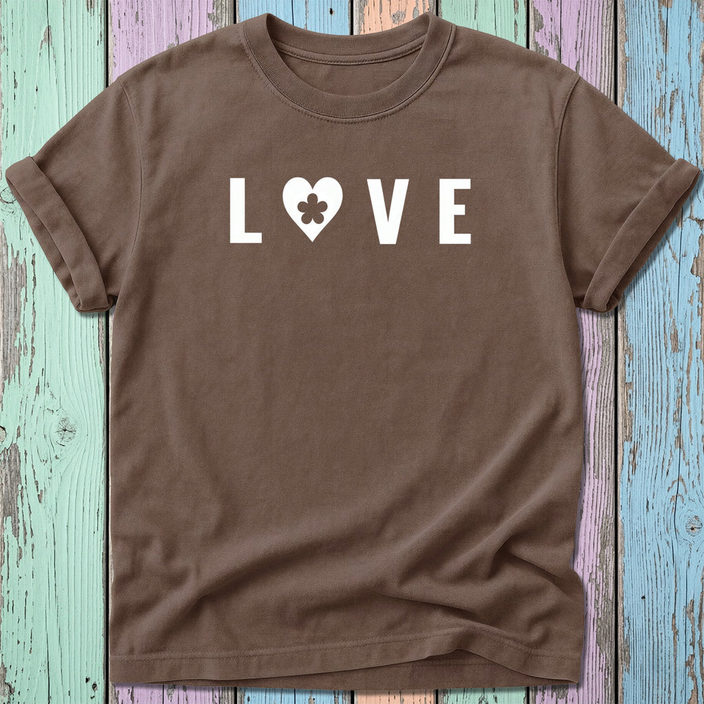 Brown t-shirt with white "LOVE" text and a heart containing a clover.