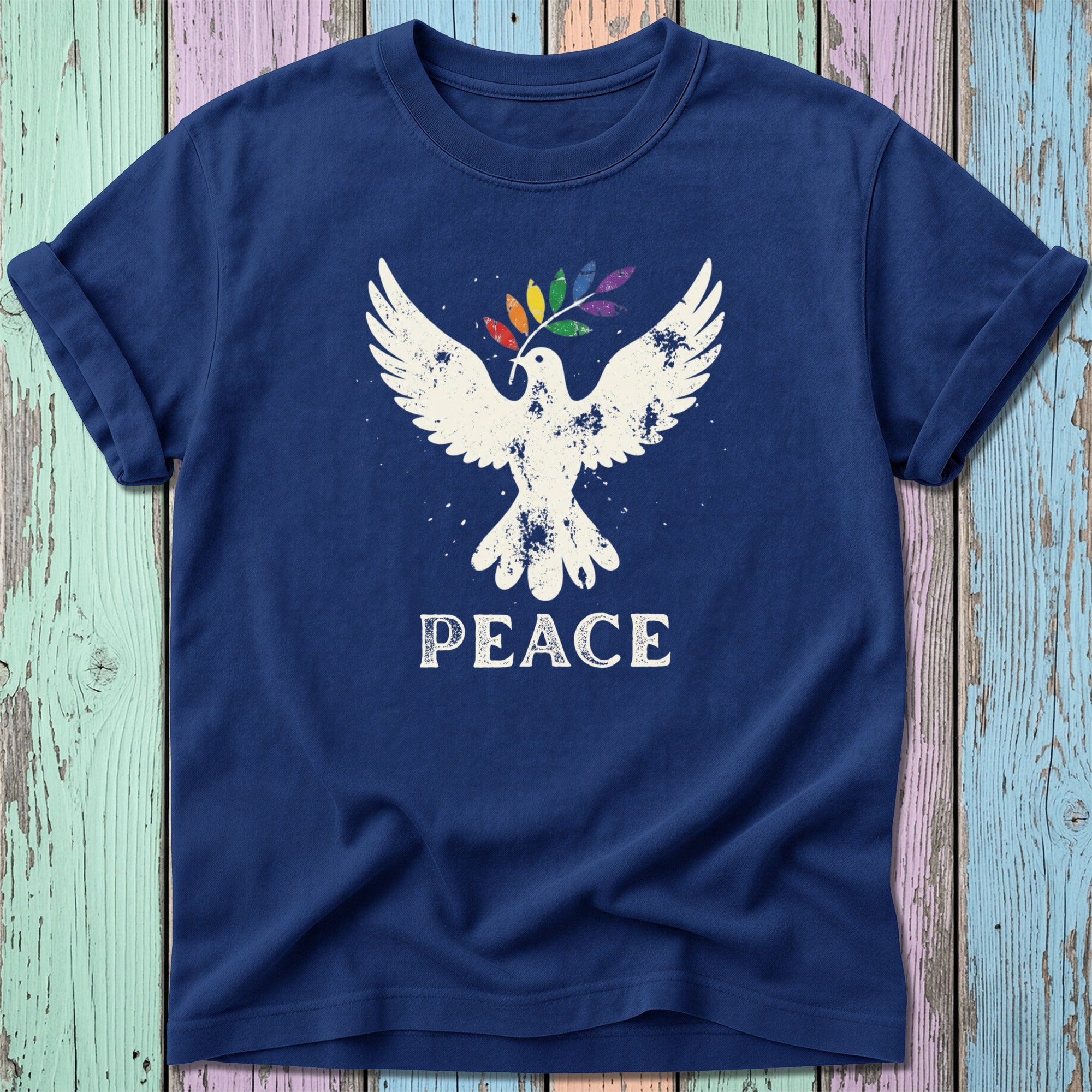 Navy t-shirt with white dove holding a rainbow olive branch and the word "PEACE".
