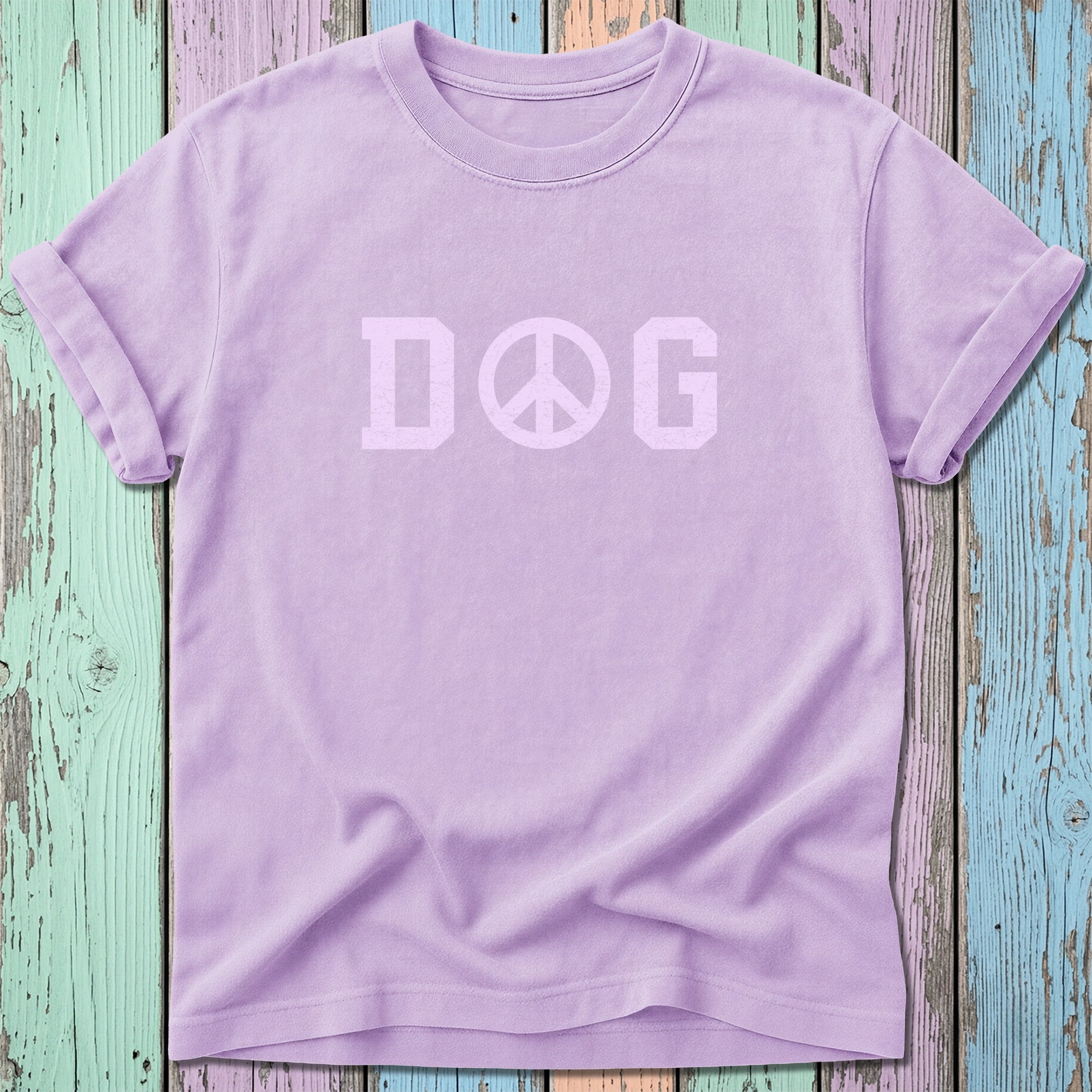 Lilac t-shirt with "DOG" in a peace sign graphic.