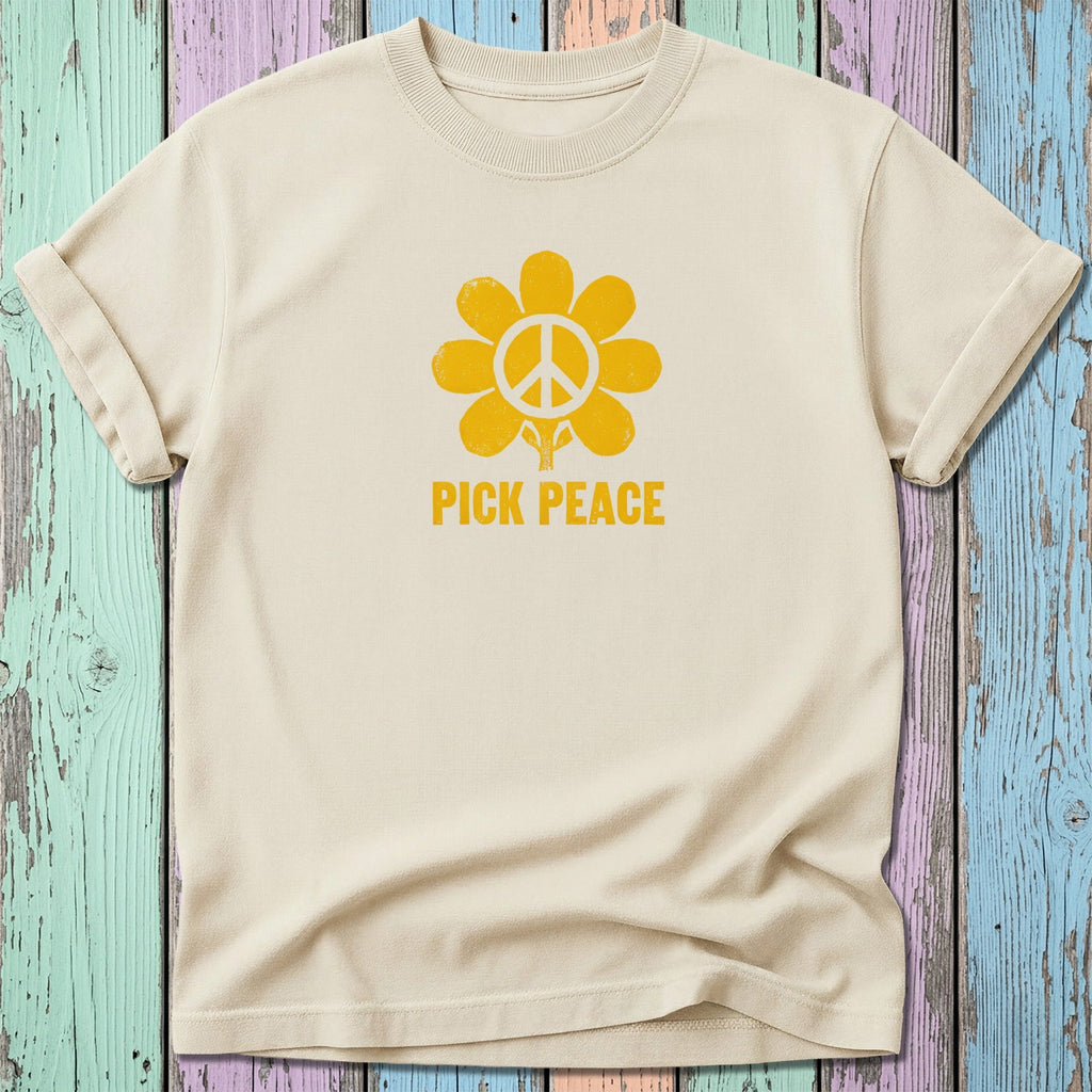 Cream t-shirt with yellow peace sign flower and "PICK PEACE" text.