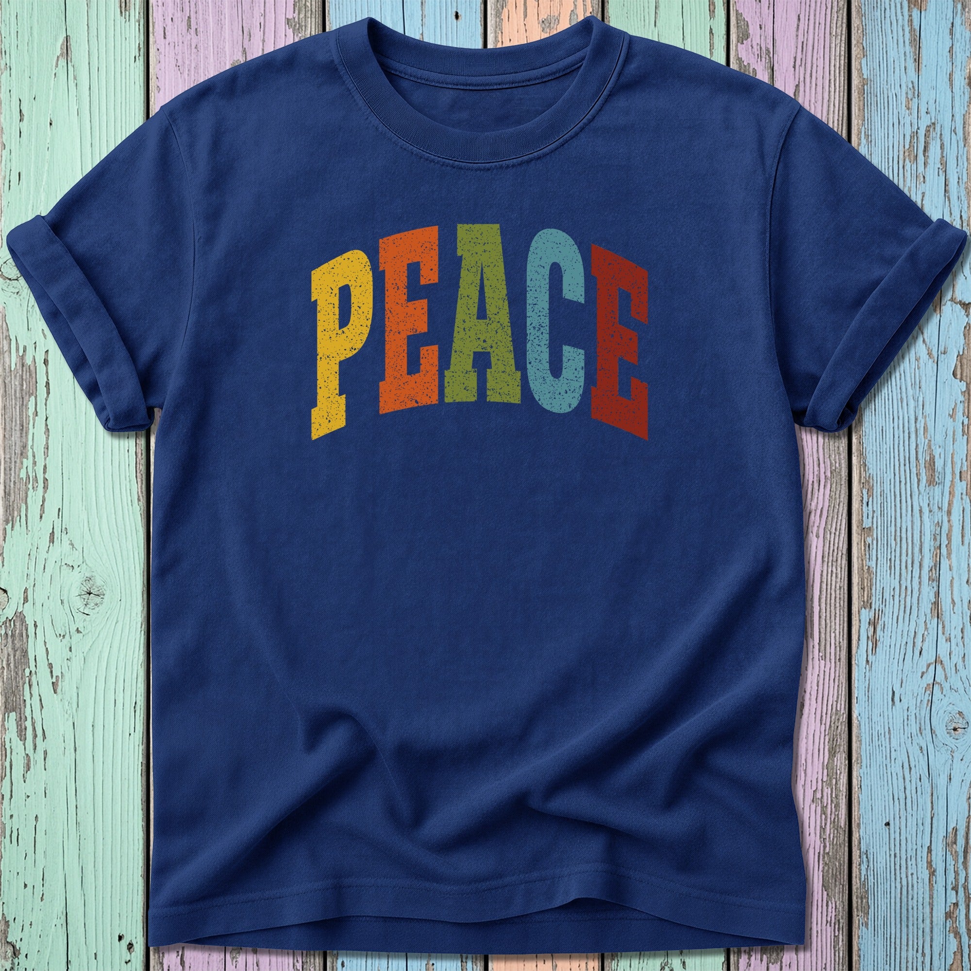 Navy t-shirt with colorful "PEACE" text in a retro font.