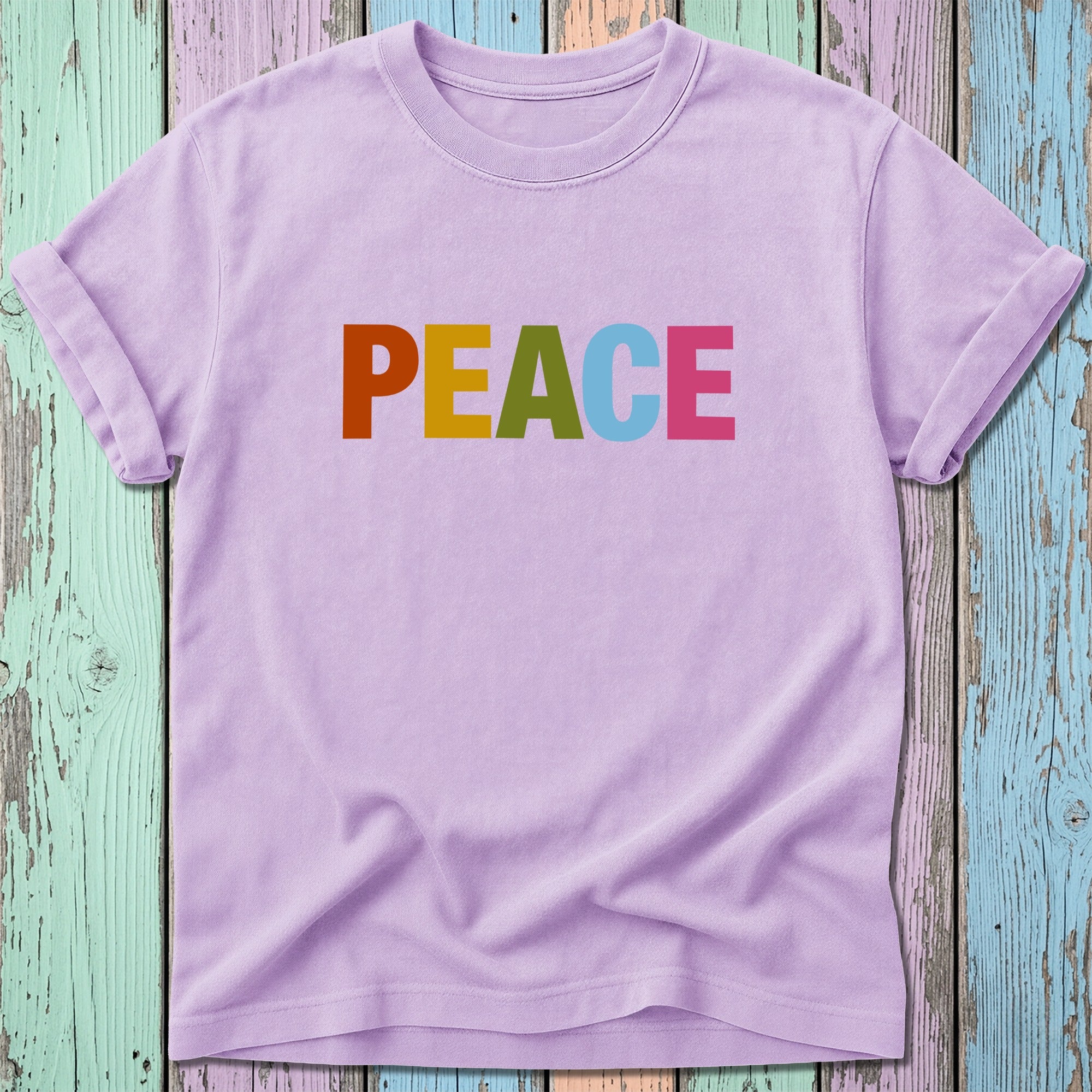 Purple t-shirt with colorful "PEACE" text.