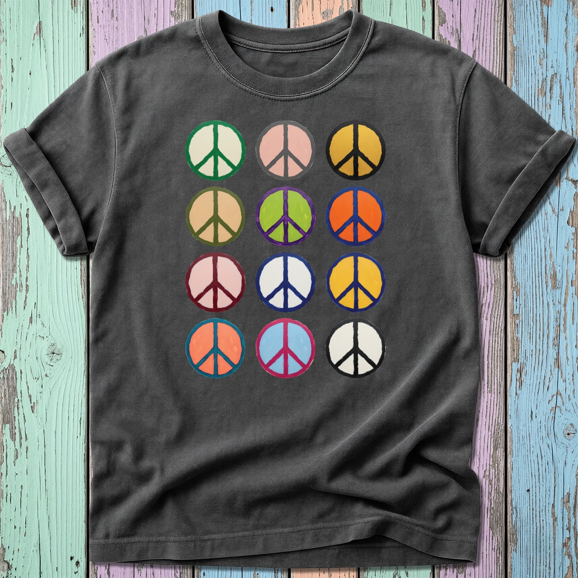 Dark t-shirt with a grid of colorful peace signs.