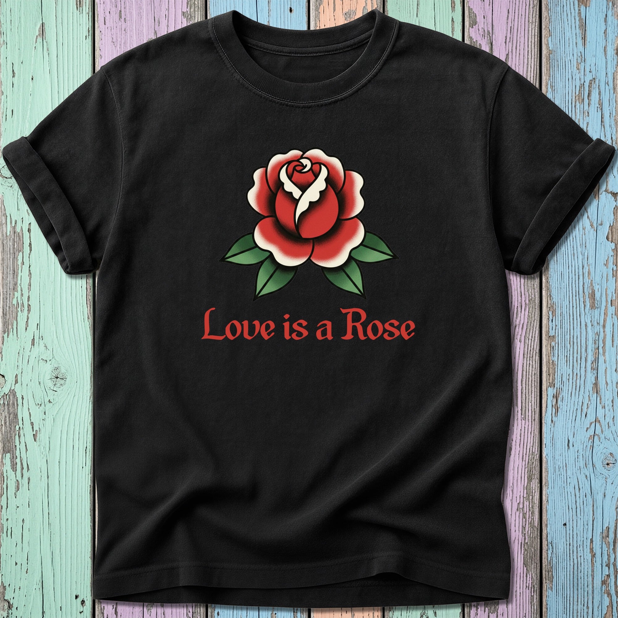 Black t-shirt with red rose and green leaves, text "Love is a Rose".