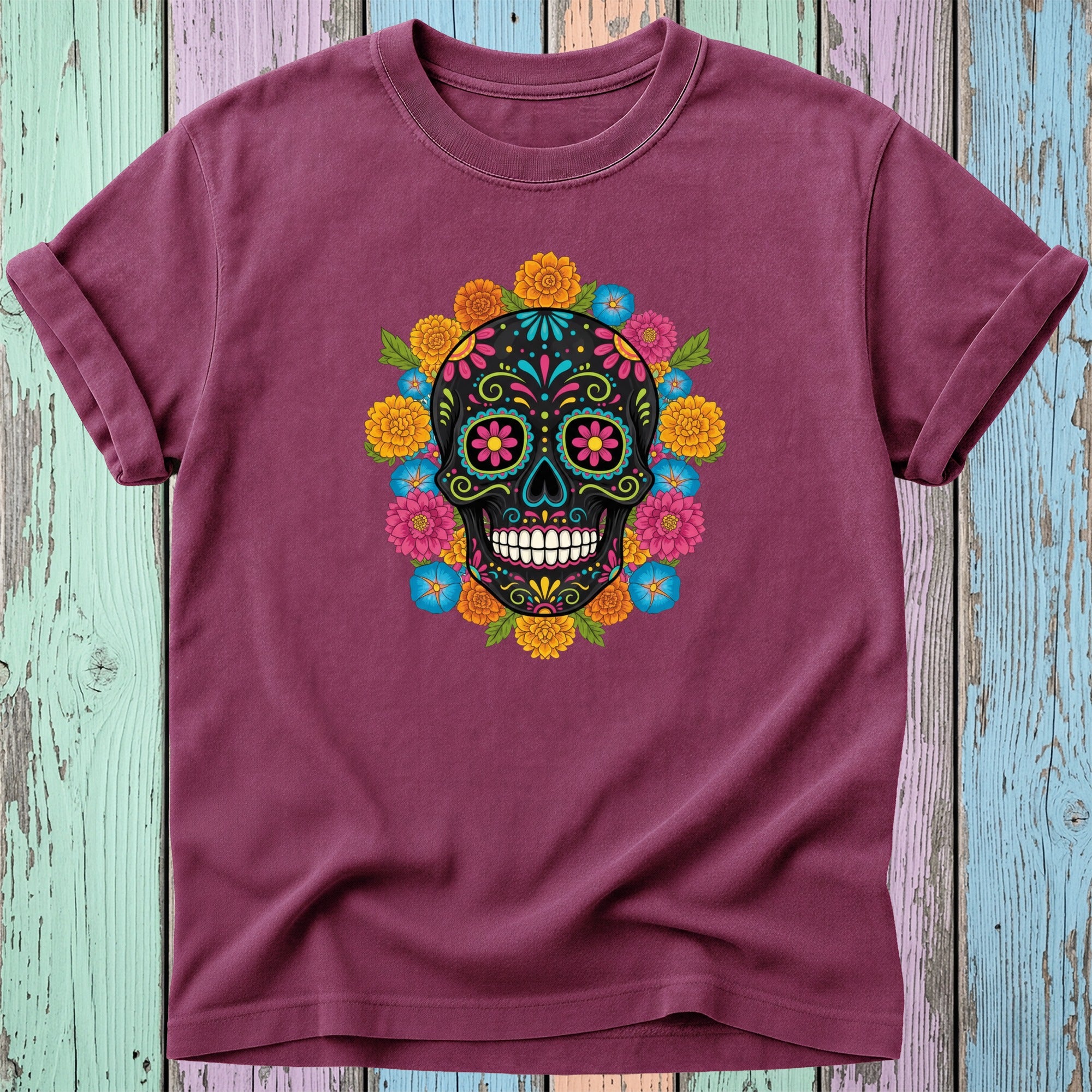 Burgundy t-shirt with a colorful Day of the Dead sugar skull floral design.