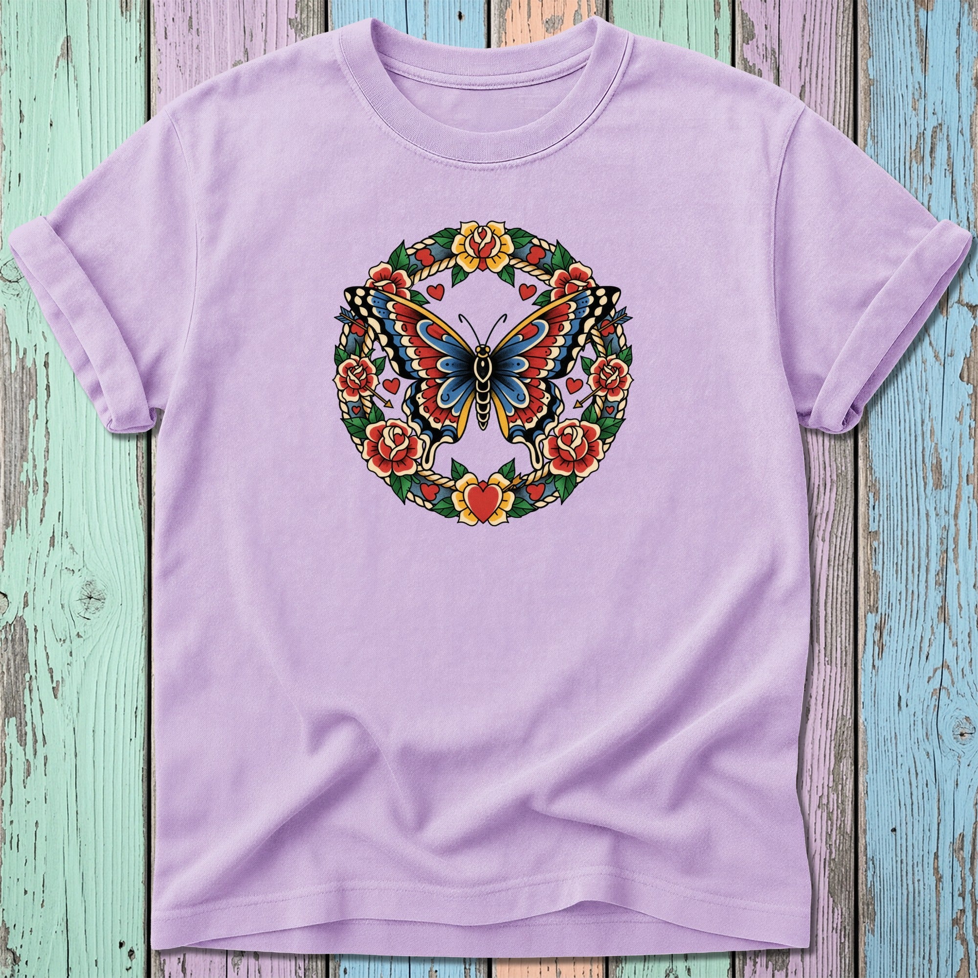 Lavender t-shirt with a traditional tattoo-style butterfly and floral wreath design.