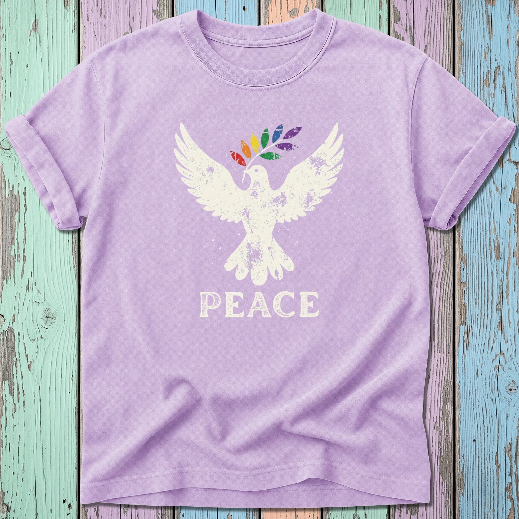 Purple t-shirt with white distressed dove holding a rainbow peace sign.