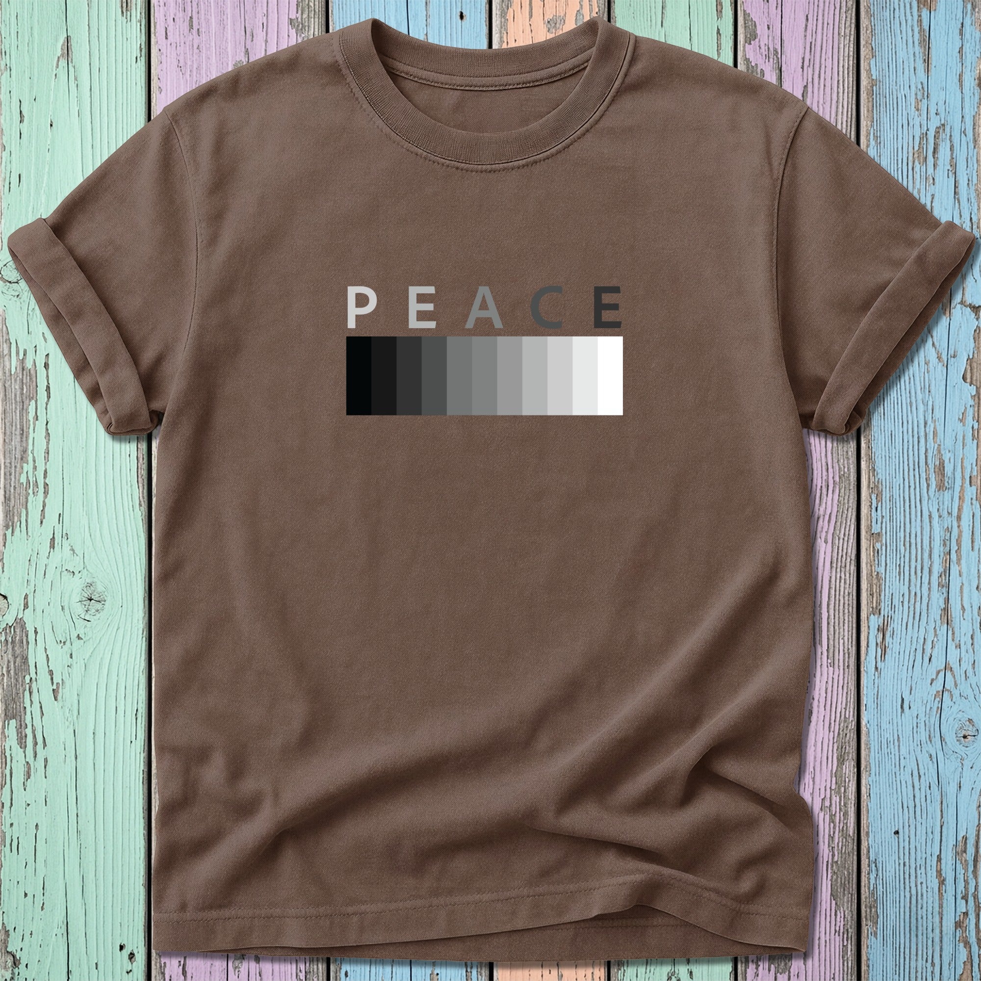 Brown t-shirt with grayscale "PEACE" text in a horizontal block.