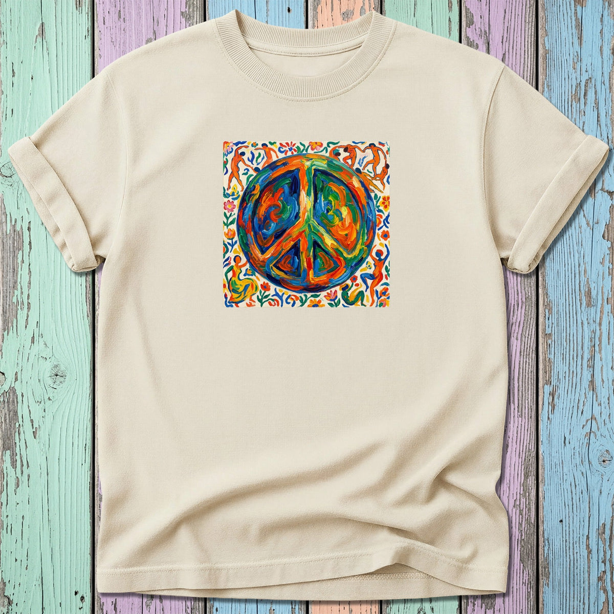 Cream t-shirt with colorful abstract peace sign and dancing figures graphic.