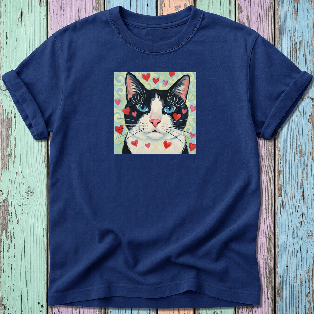 Navy t-shirt with black and white cat portrait surrounded by hearts.