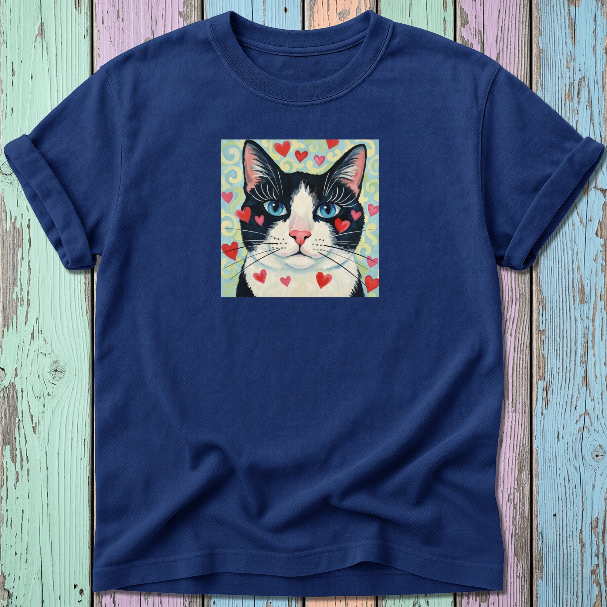 Navy t-shirt with black and white cat portrait surrounded by hearts.