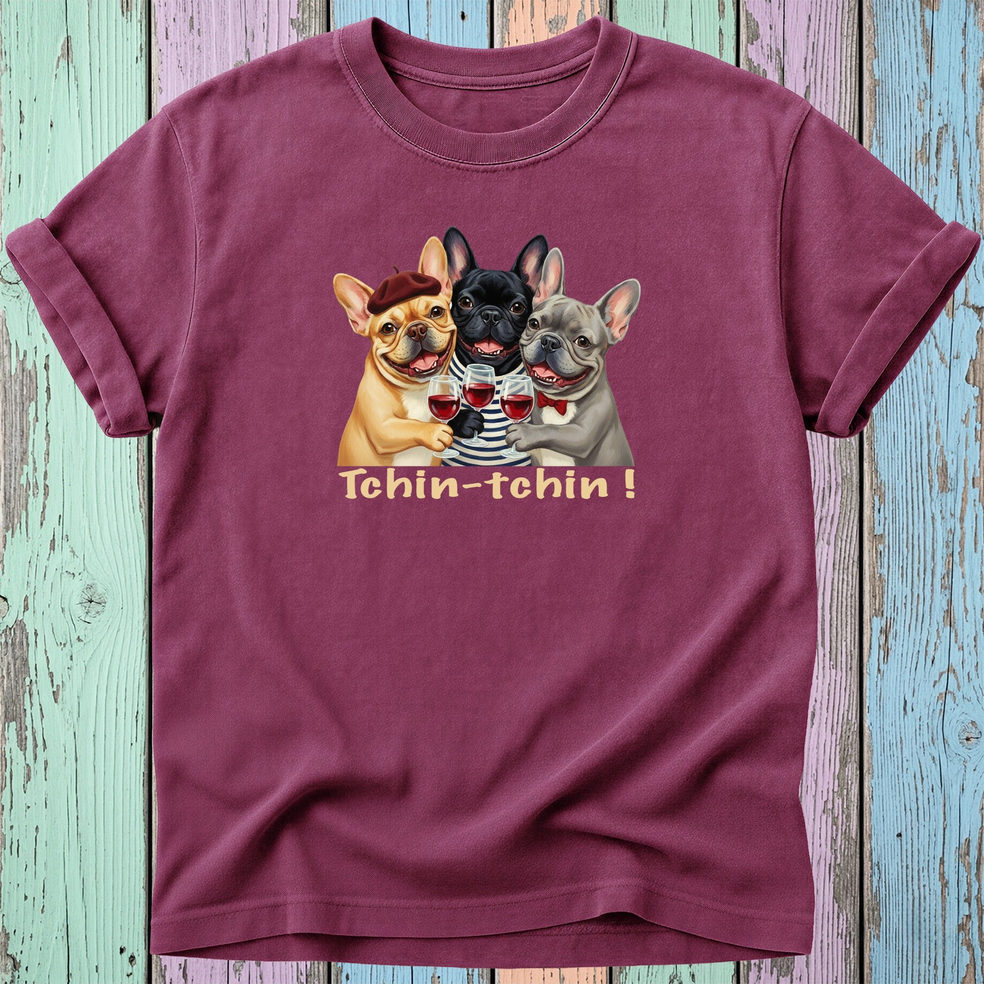 Three French Bulldogs in shirts clink glasses, saying "Tchin-tchin!".