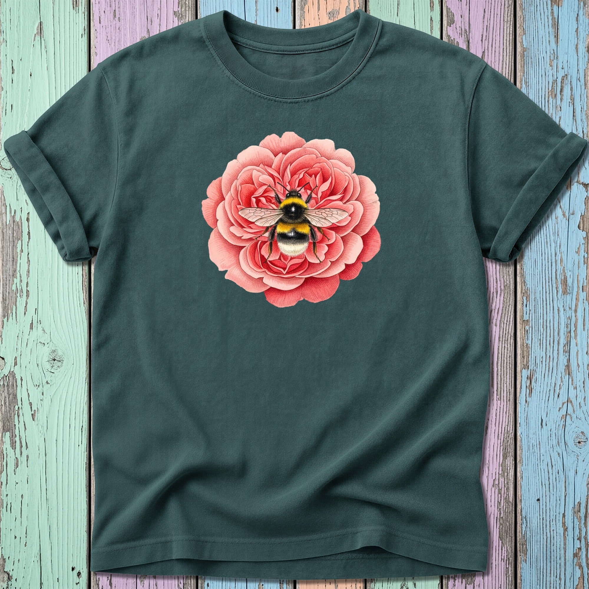 Dark teal t-shirt with a bee on a pink rose illustration.
