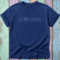 Navy t-shirt with "Peace, Love & Dogs" graphic on a colorful wooden background.