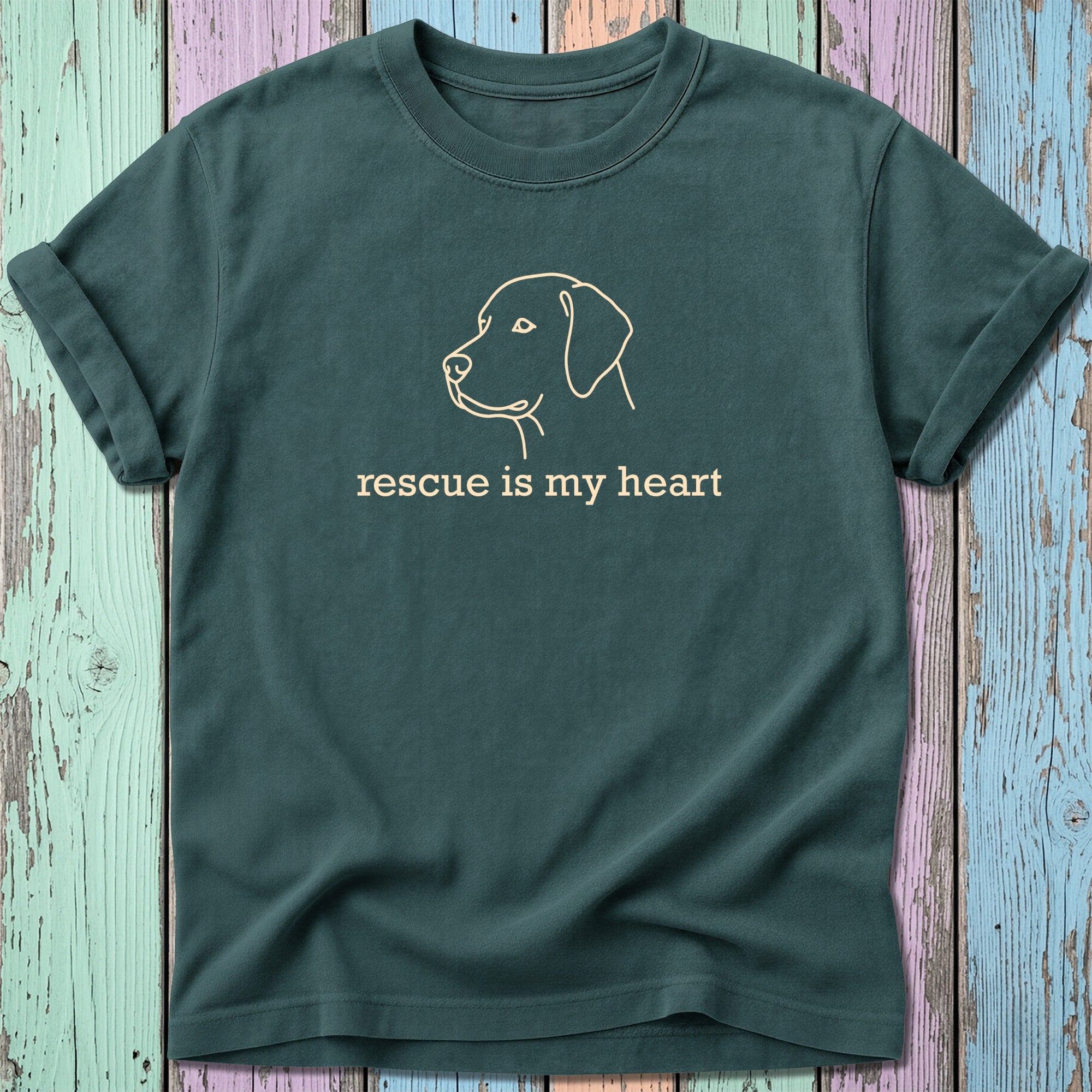 Green t-shirt with a line drawing of a dog's head and "rescue is my heart" text.