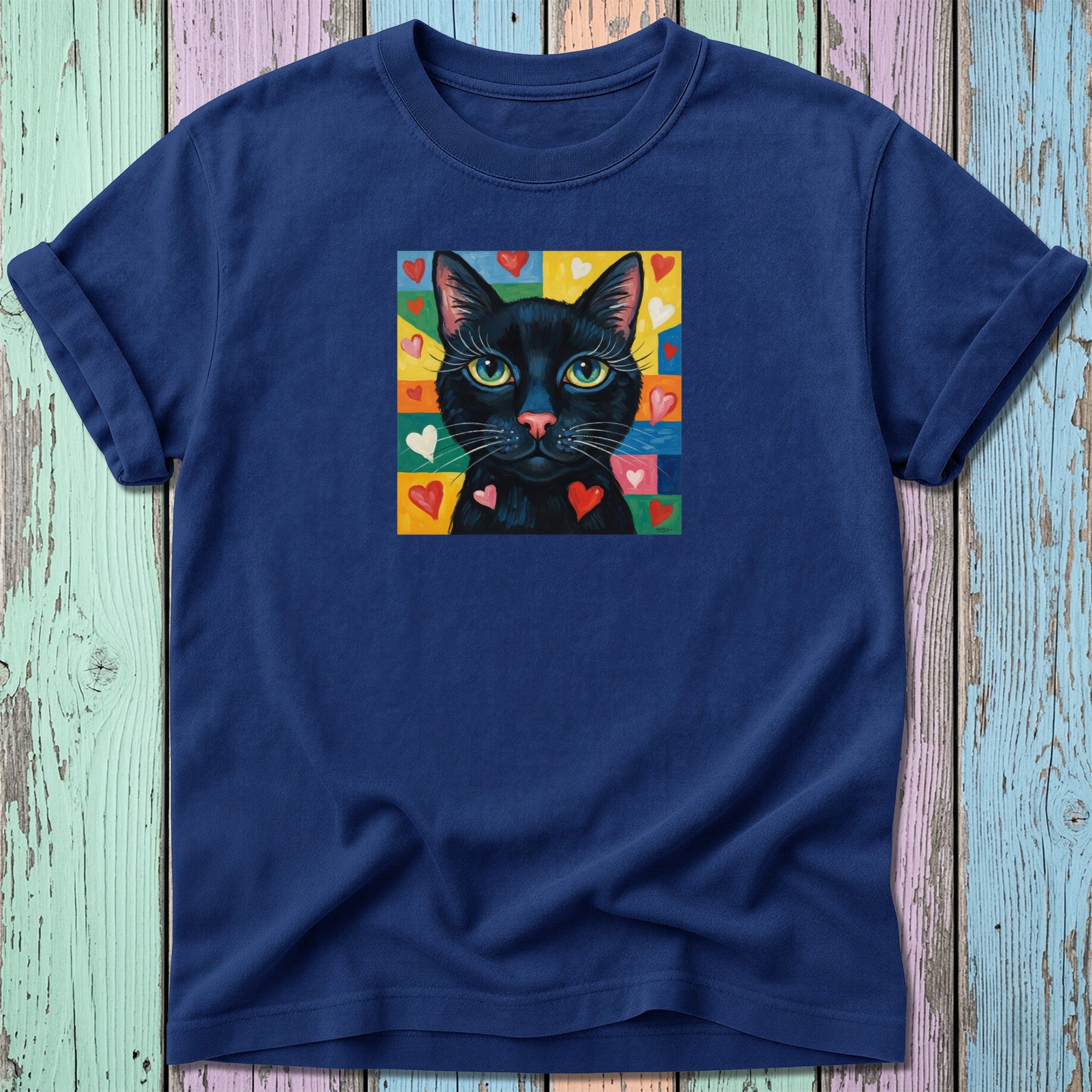 Navy t-shirt with a black cat surrounded by colorful hearts.