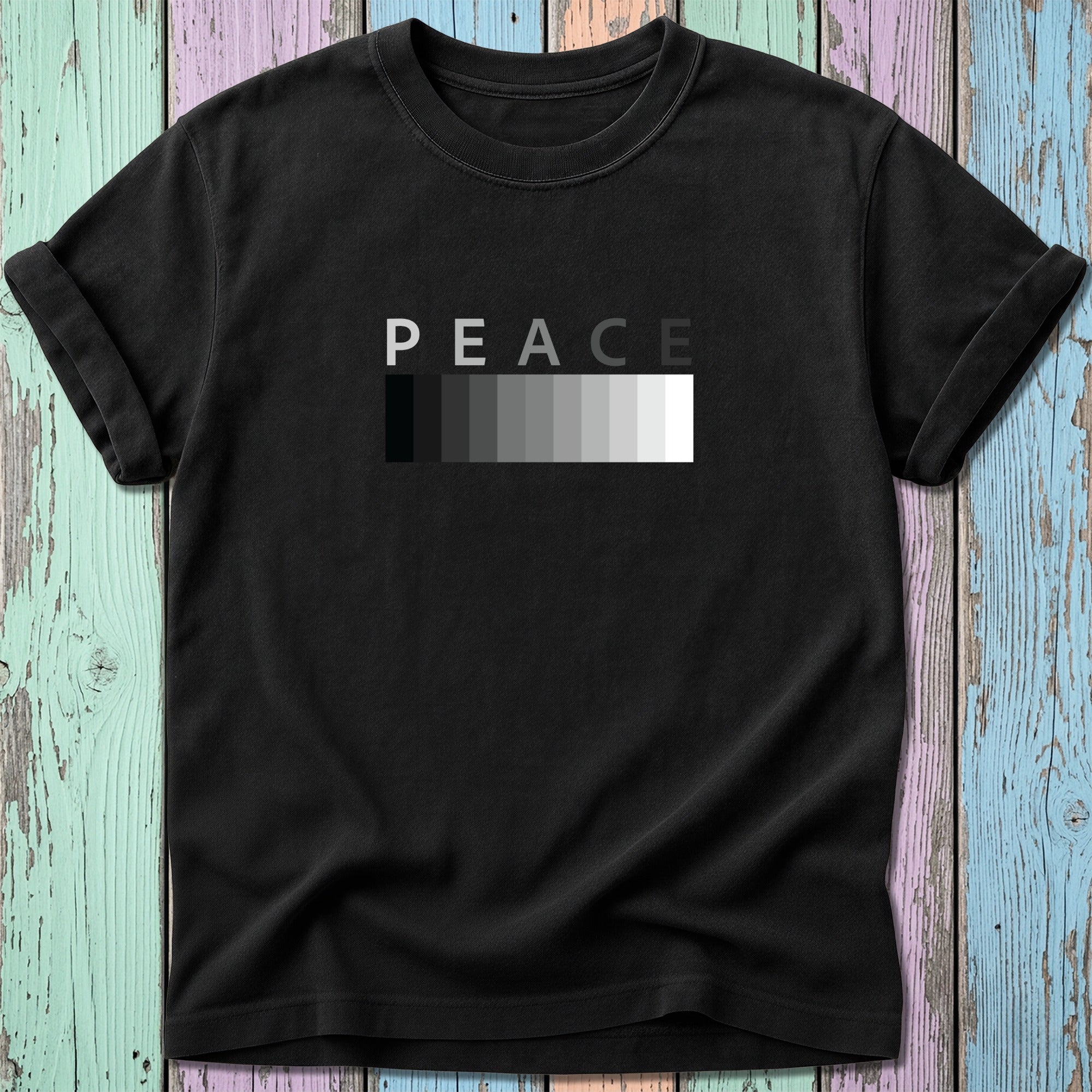 Black t-shirt with white "PEACE" text above a grayscale gradient bar.