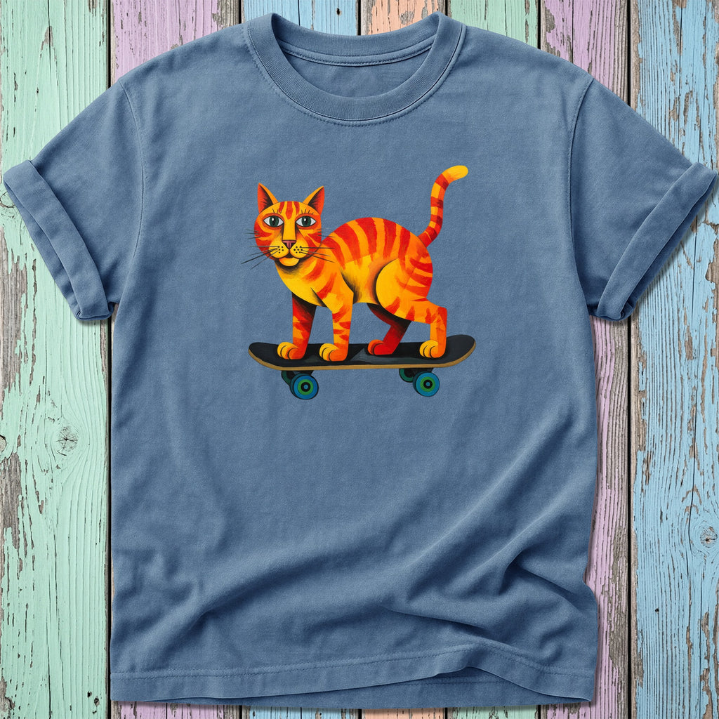 Orange tabby cat riding a skateboard, blue t-shirt design.
