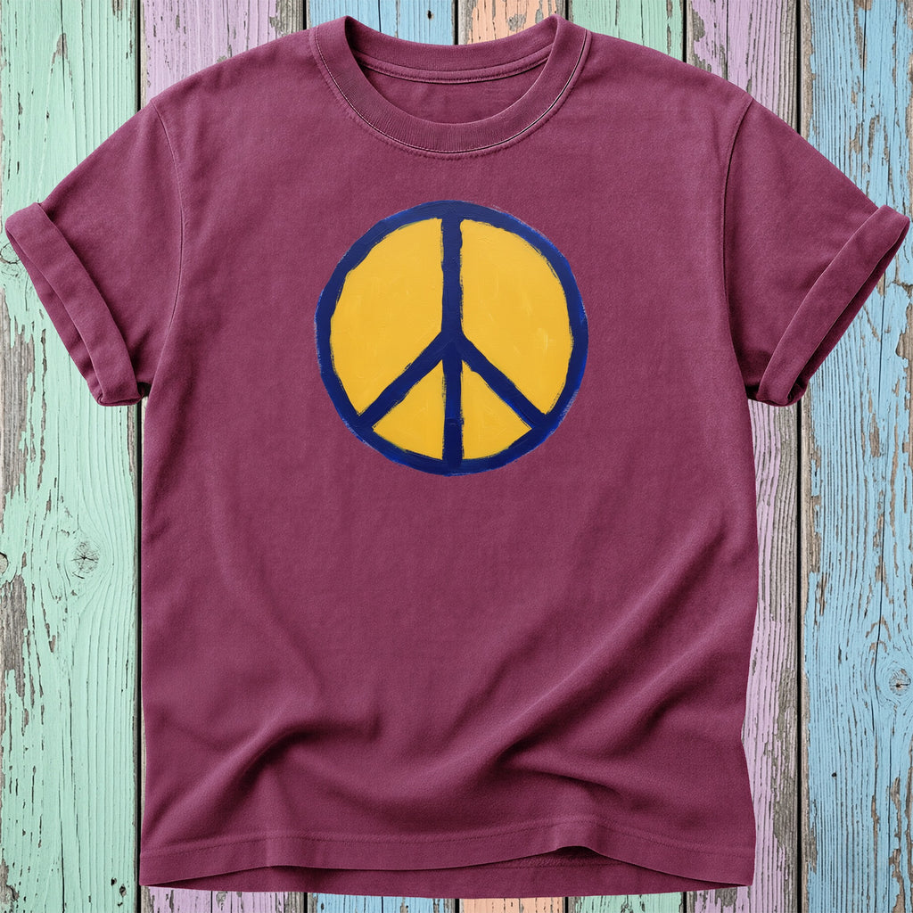 Maroon t-shirt with a yellow and blue peace sign graphic.