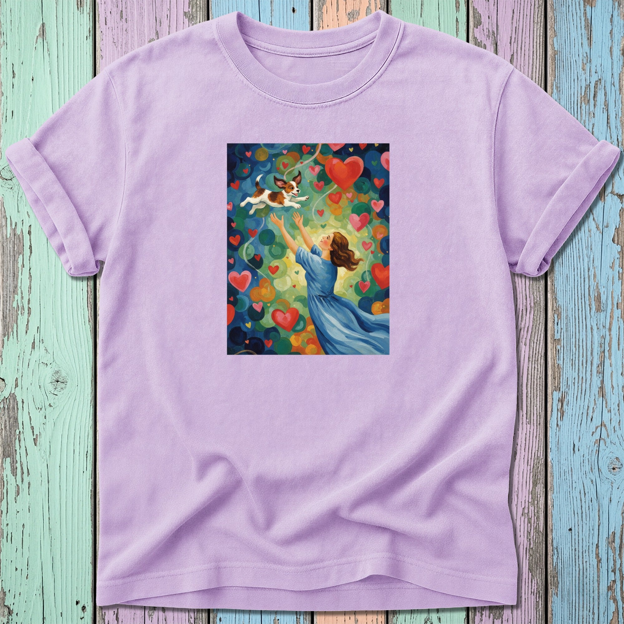 Woman in blue dress reaching for a dog amidst colorful hearts.