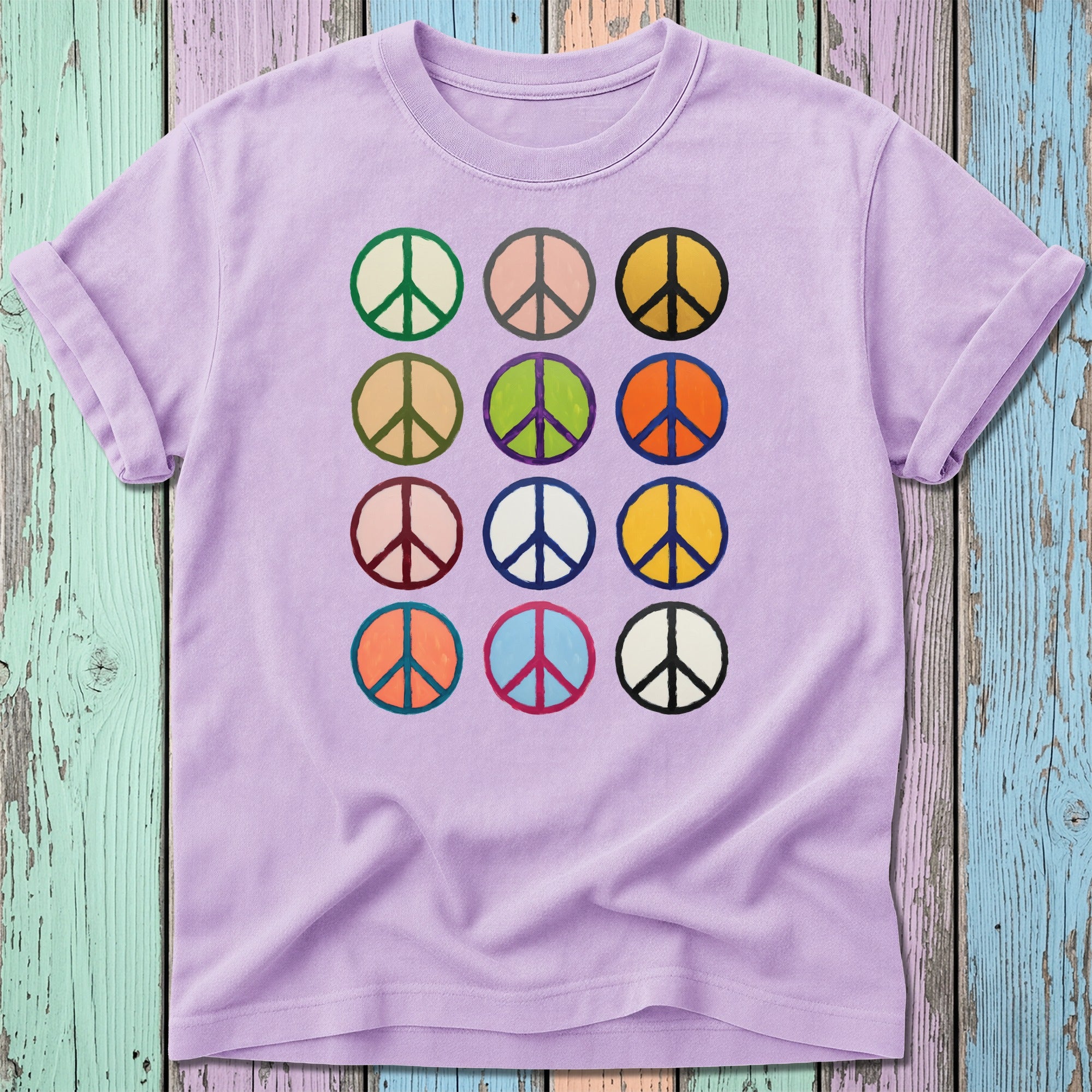 Purple t-shirt with a grid of colorful peace signs.