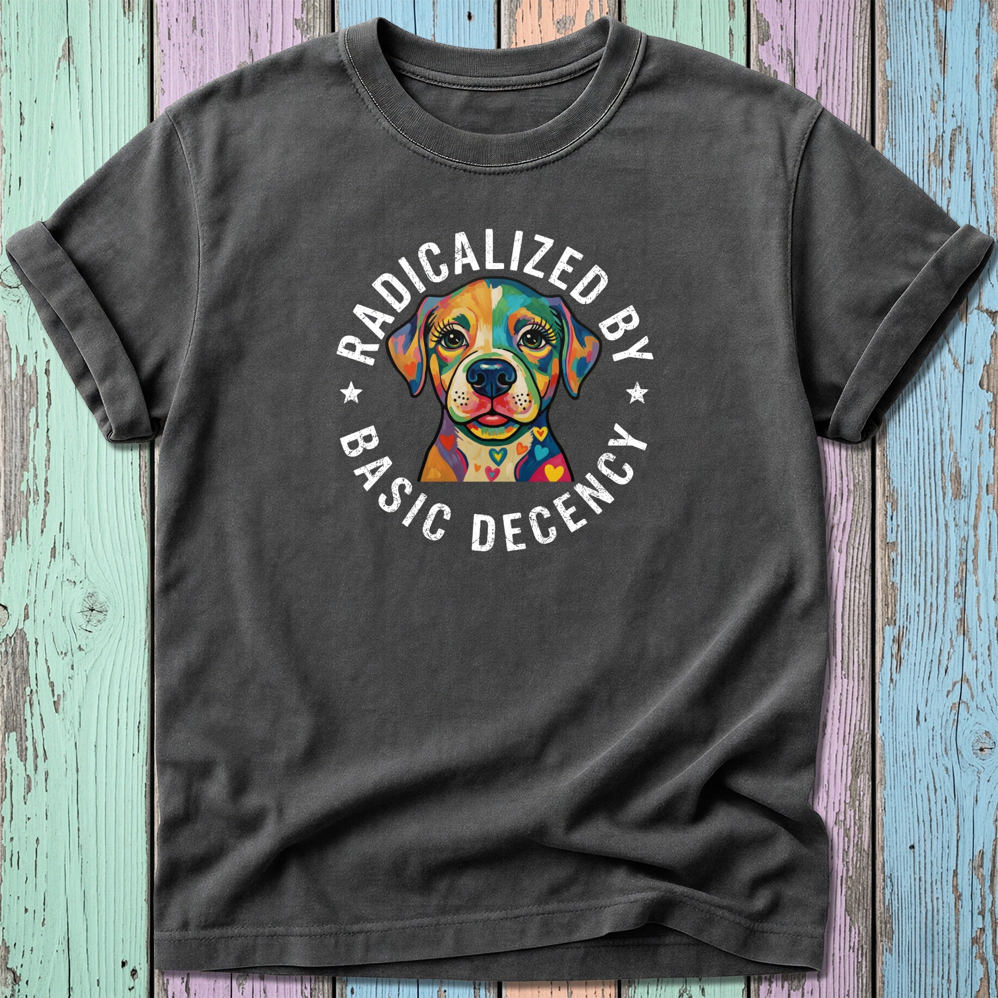 T-shirt with colorful dog and "Radicalized by Basic Decency" text.