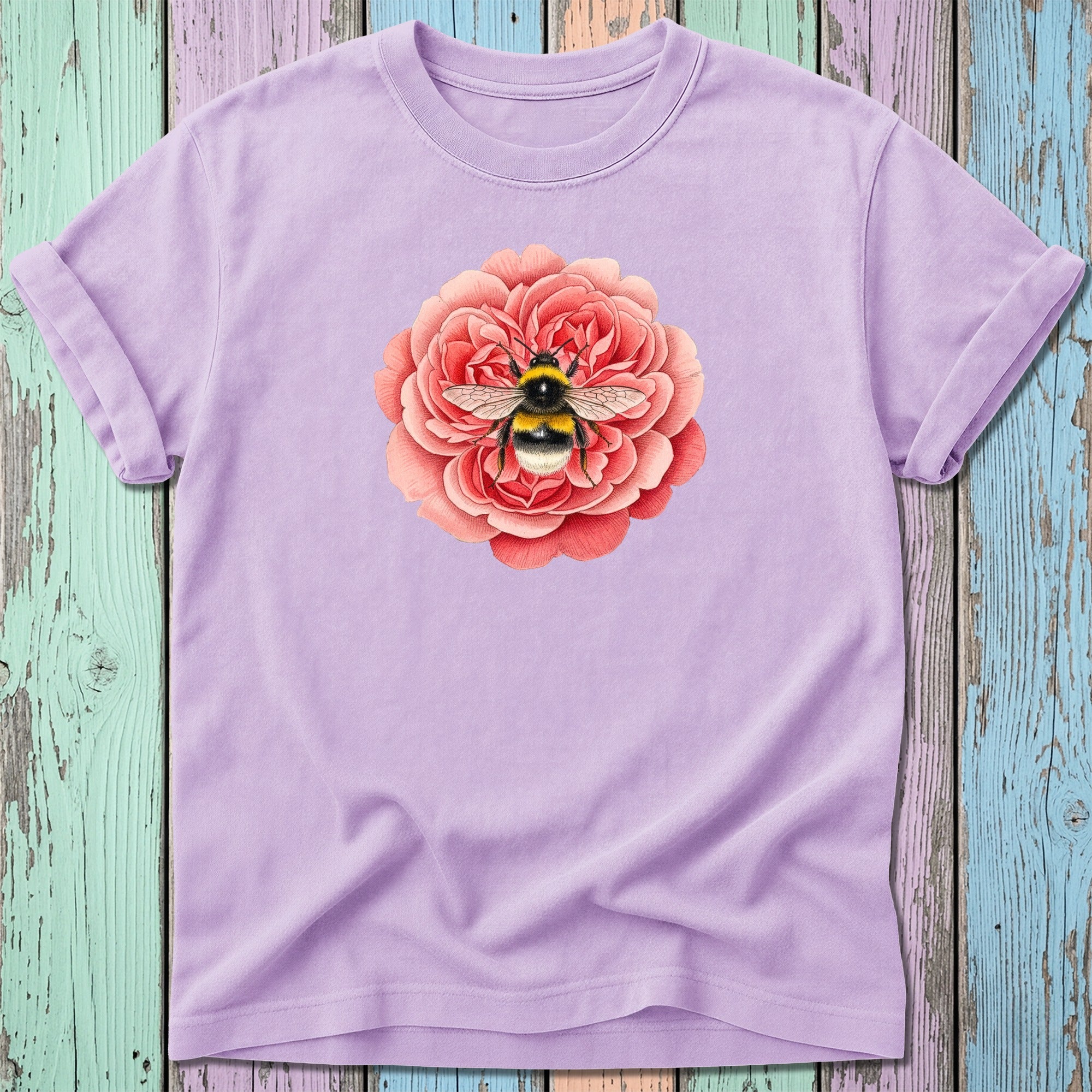 Lilac t-shirt featuring a realistic bee on a pink rose.
