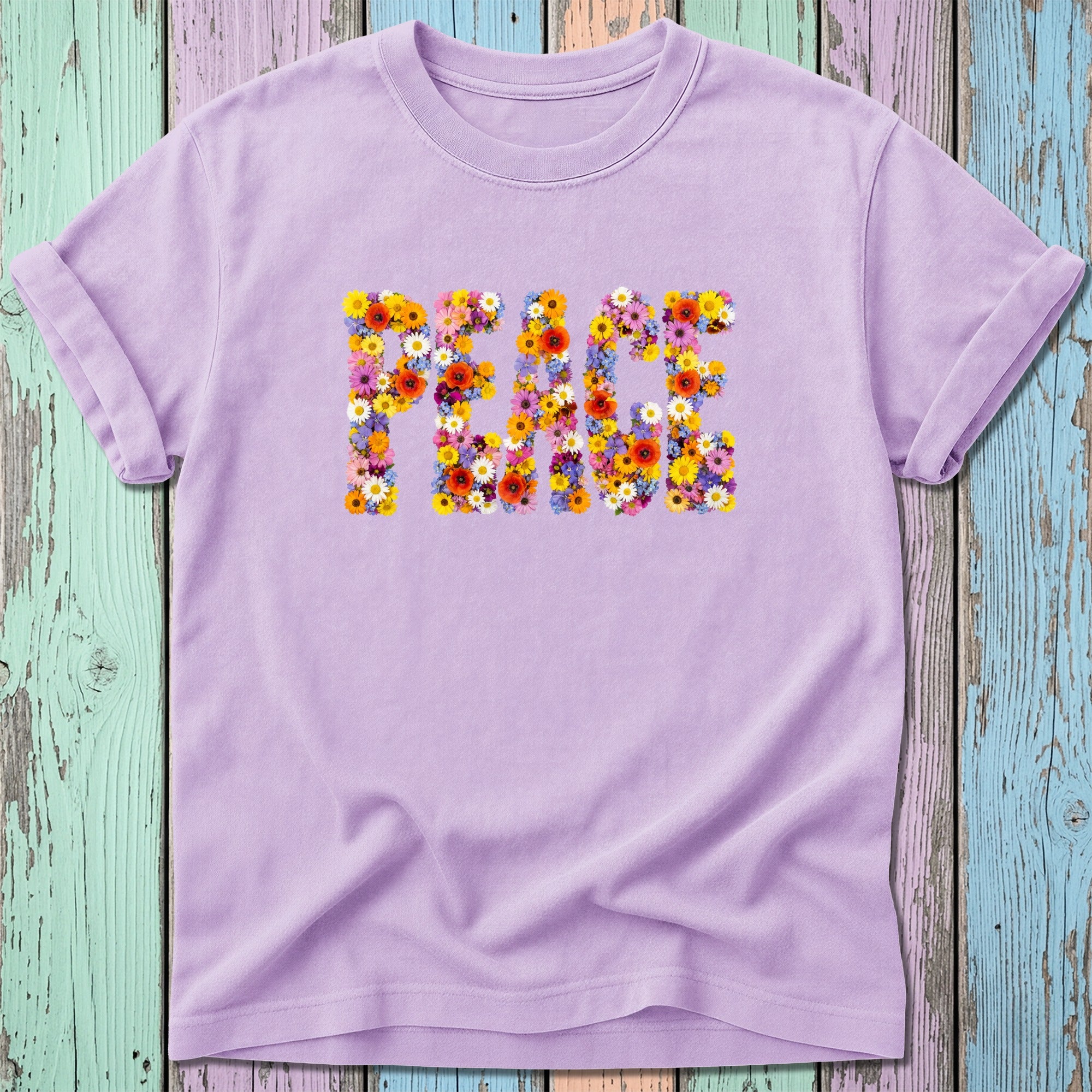 Purple t-shirt with the word PEACE spelled out in colorful floral letters.
