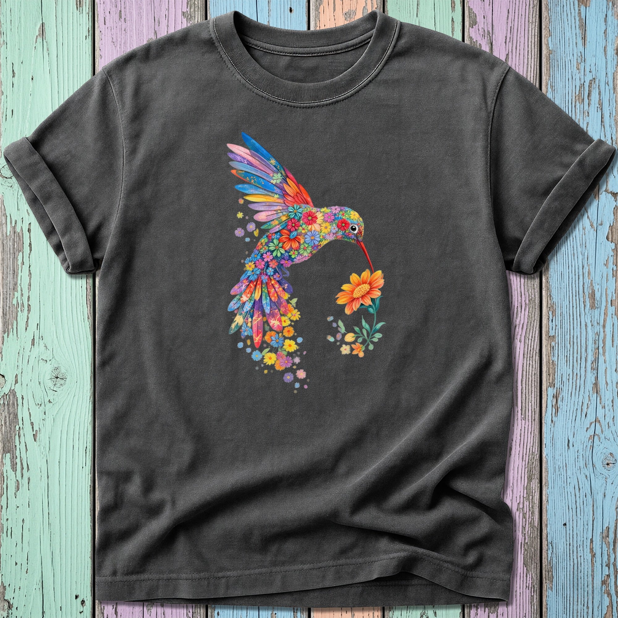 Dark t-shirt with colorful floral hummingbird drinking from a flower.