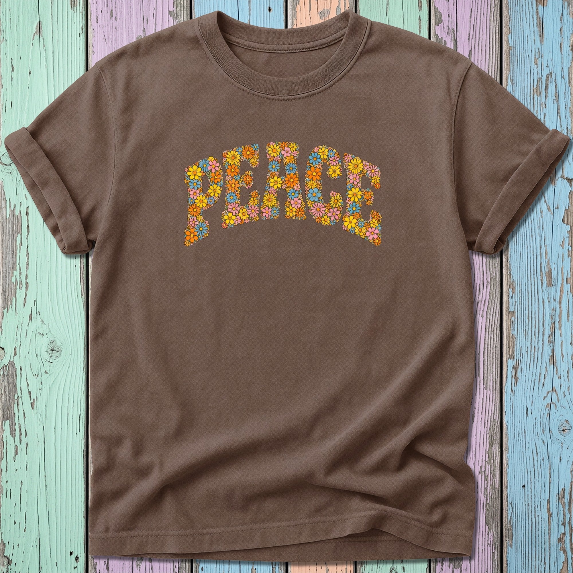 Brown t-shirt with colorful floral "Peace" graphic.