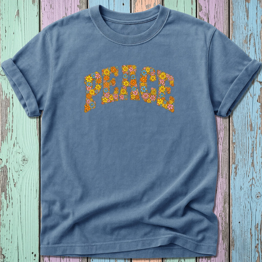 Blue t-shirt with "Peace" spelled out in colorful retro flowers.