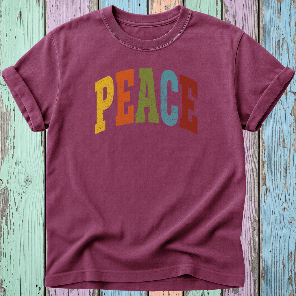 Burgundy t-shirt with "PEACE" in colorful distressed lettering.